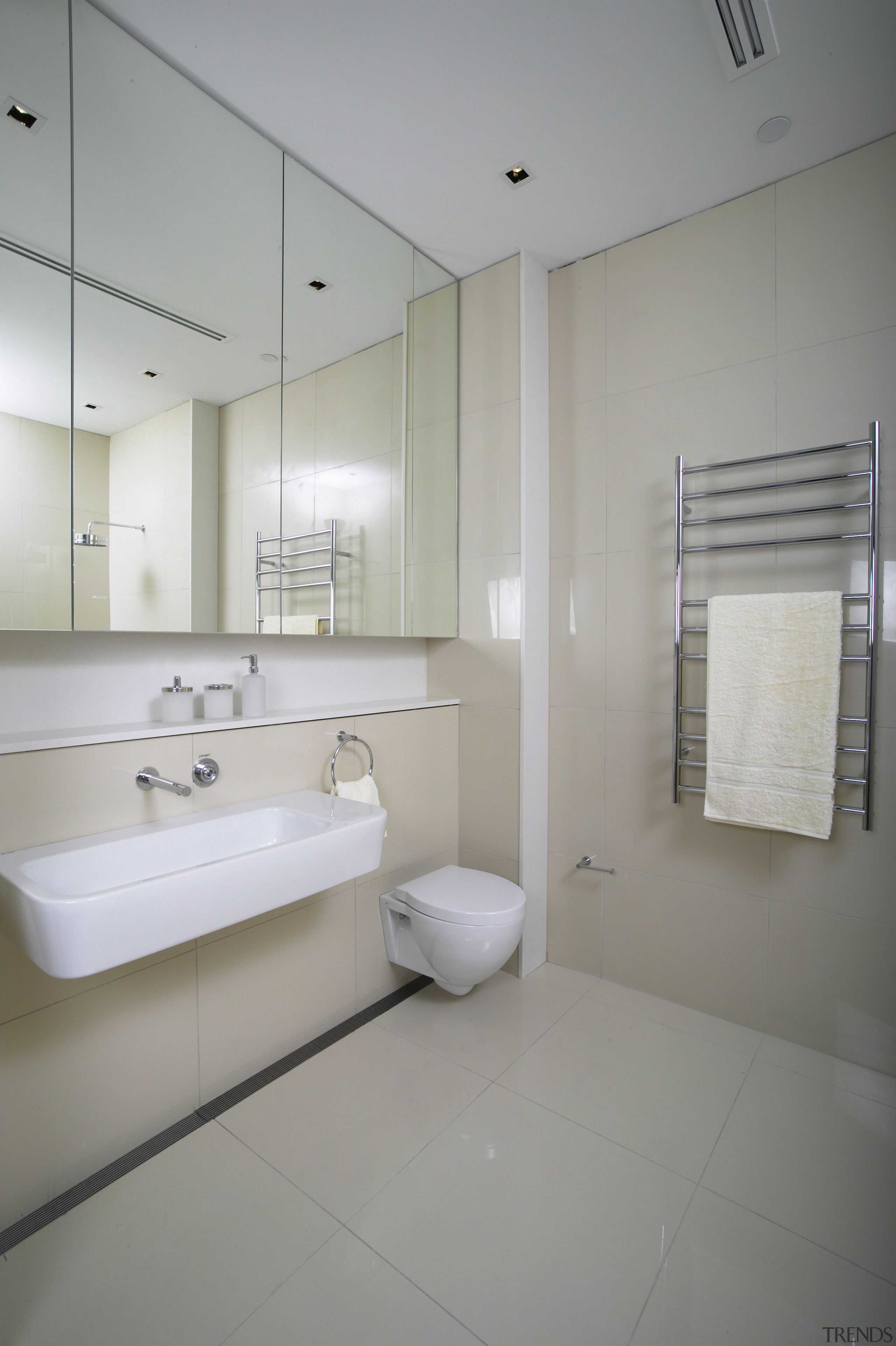 view of this simple bathroom featuring kohler toilet architecture, bathroom, bathroom accessory, daylighting, floor, home, interior design, plumbing fixture, product design, room, sink, tap, gray