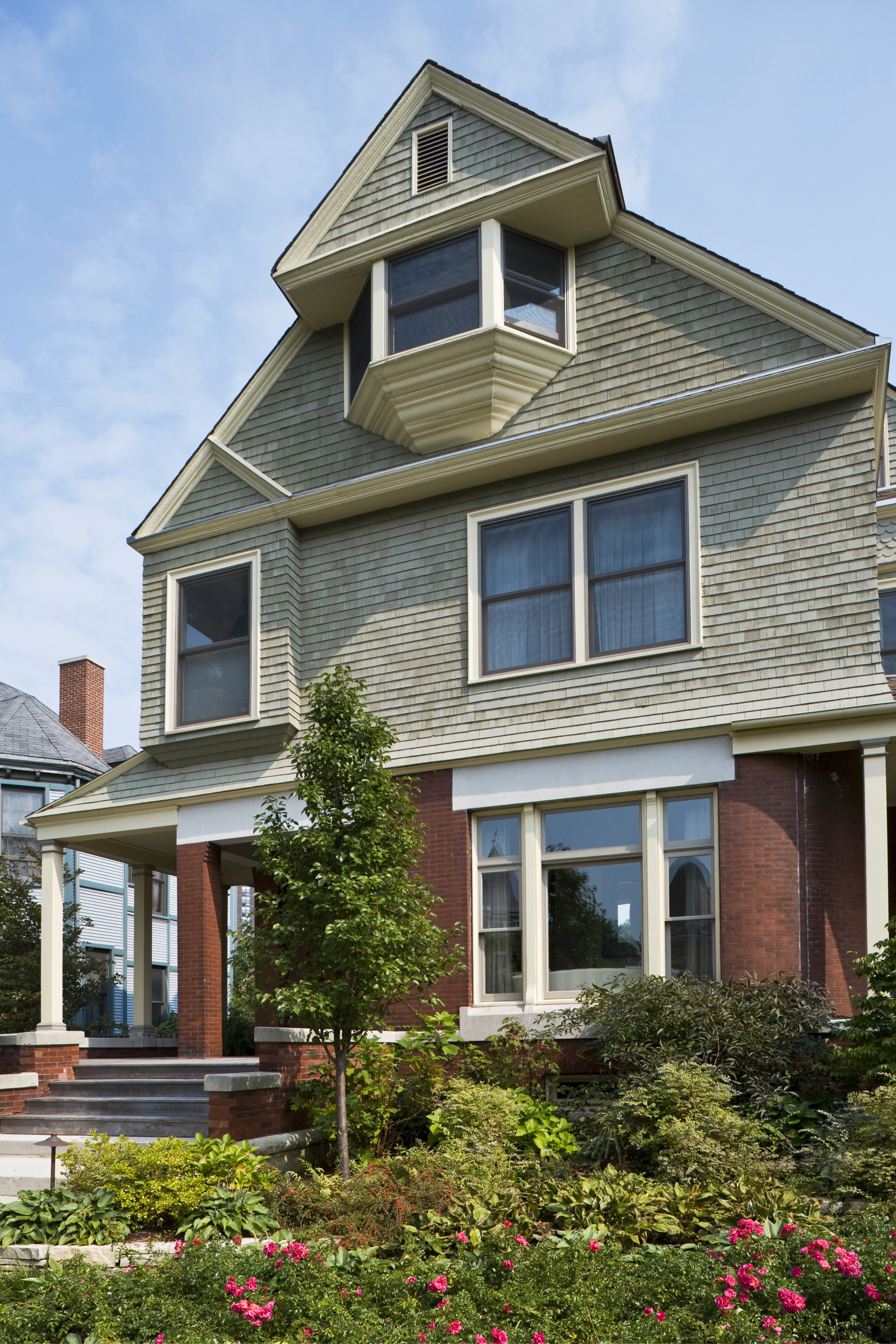 Exterior view of the house showing a Victorian architecture, building, cottage, estate, facade, home, house, neighbourhood, property, real estate, residential area, siding, sky, suburb, window, teal