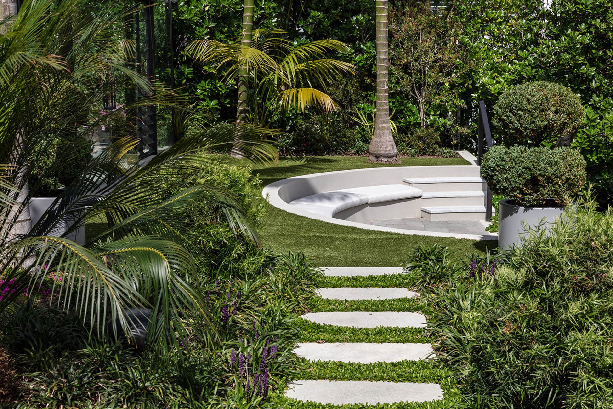 Stepping stones lead to the tucked away semi-circular 