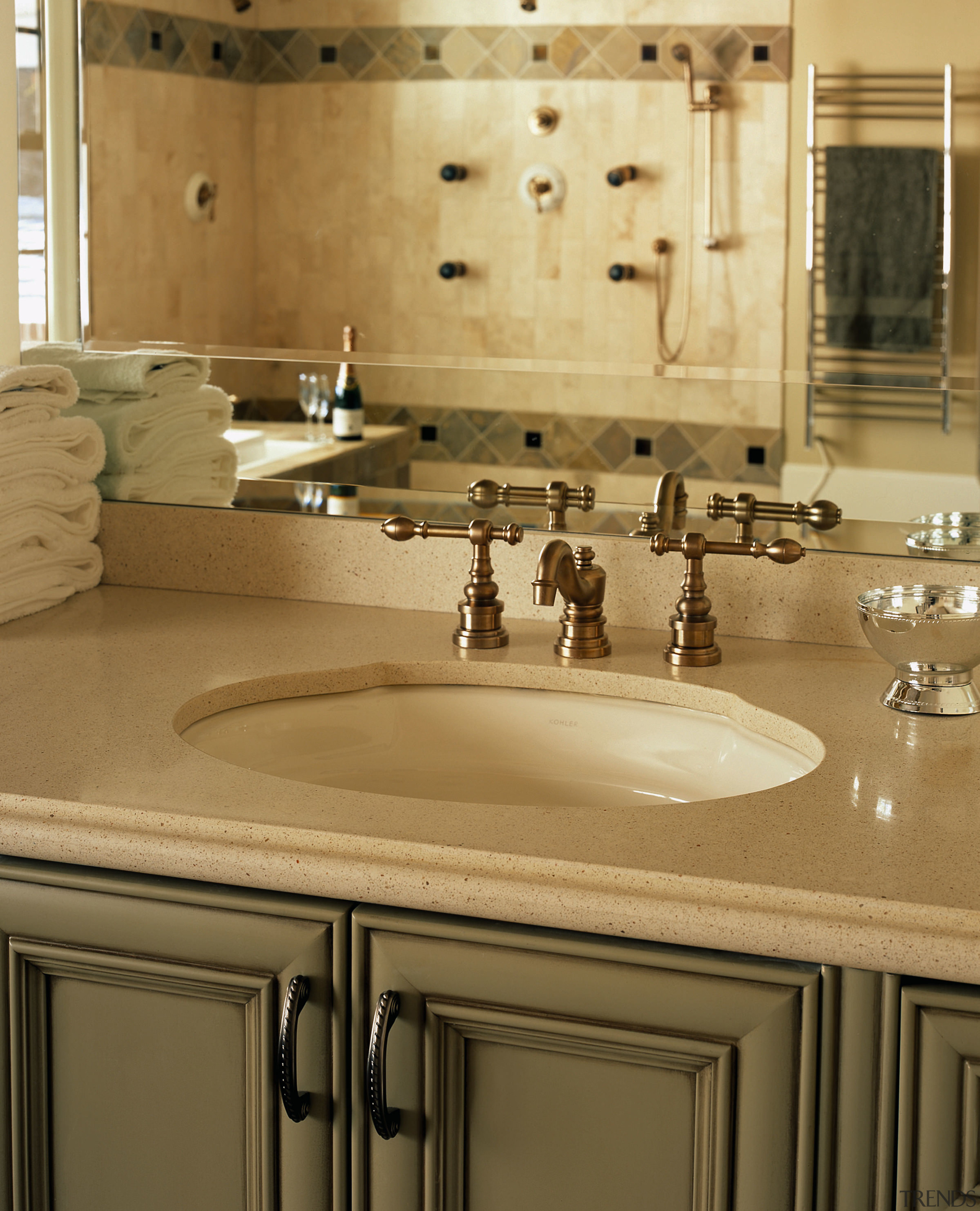 view of this bathroom vanity with a silestone bathroom, bathroom sink, cabinetry, countertop, floor, flooring, interior design, kitchen, plumbing fixture, room, sink, tap, tile, brown, orange