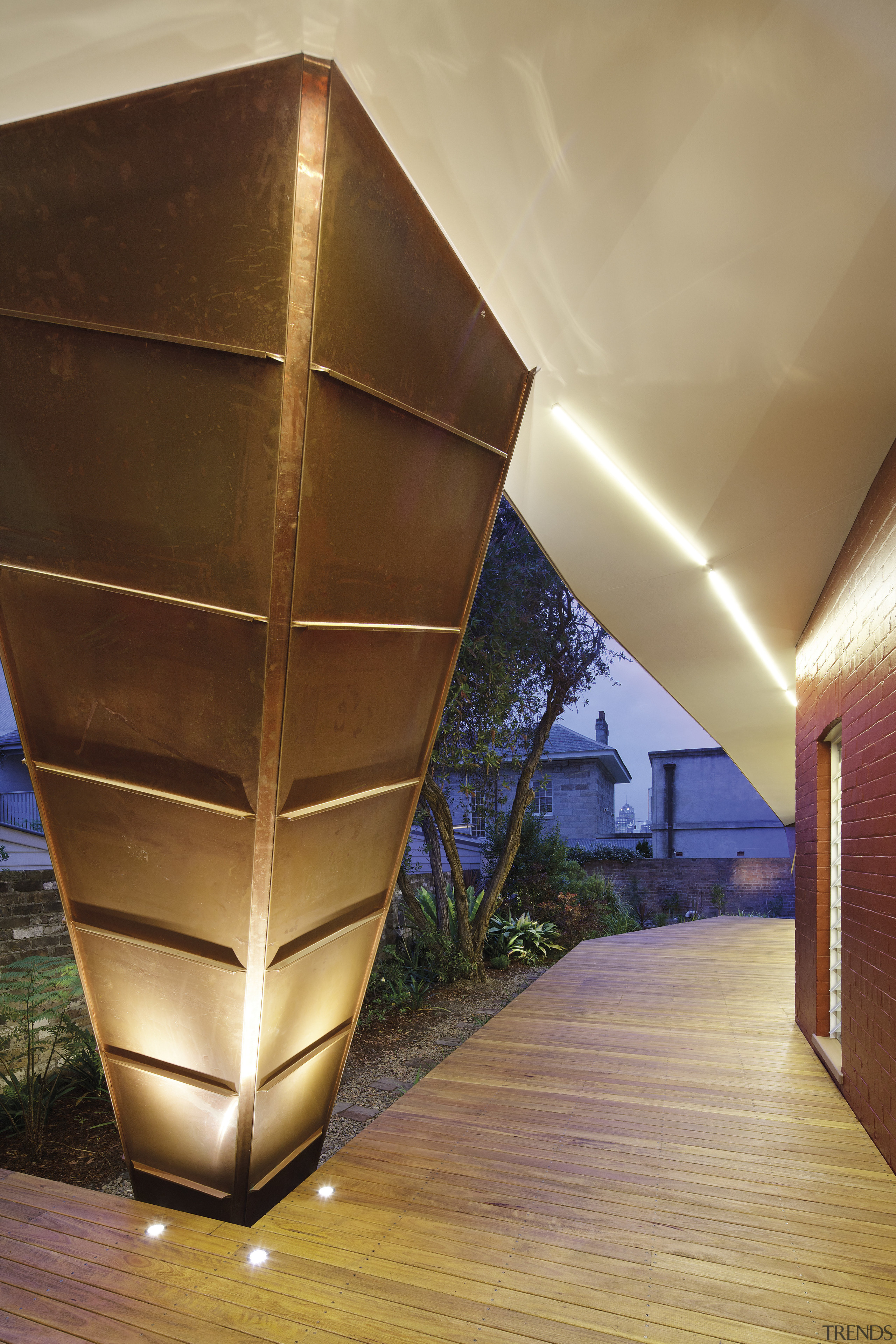 The design of the cladding references the traditional architecture, daylighting, light, lighting, wood, brown, orange