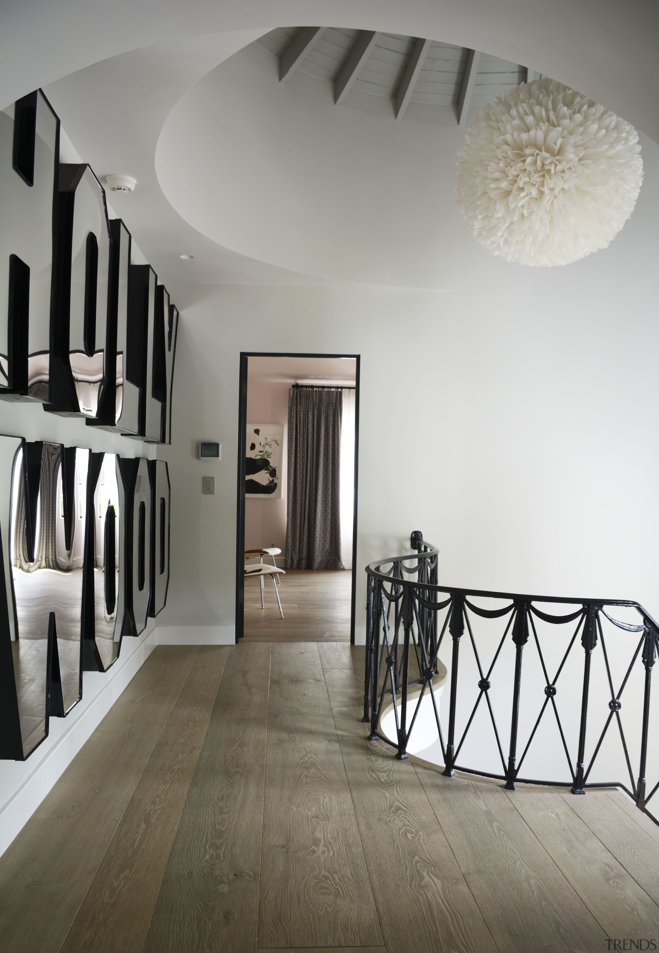 A mirrored letter wall sculpture at the top 