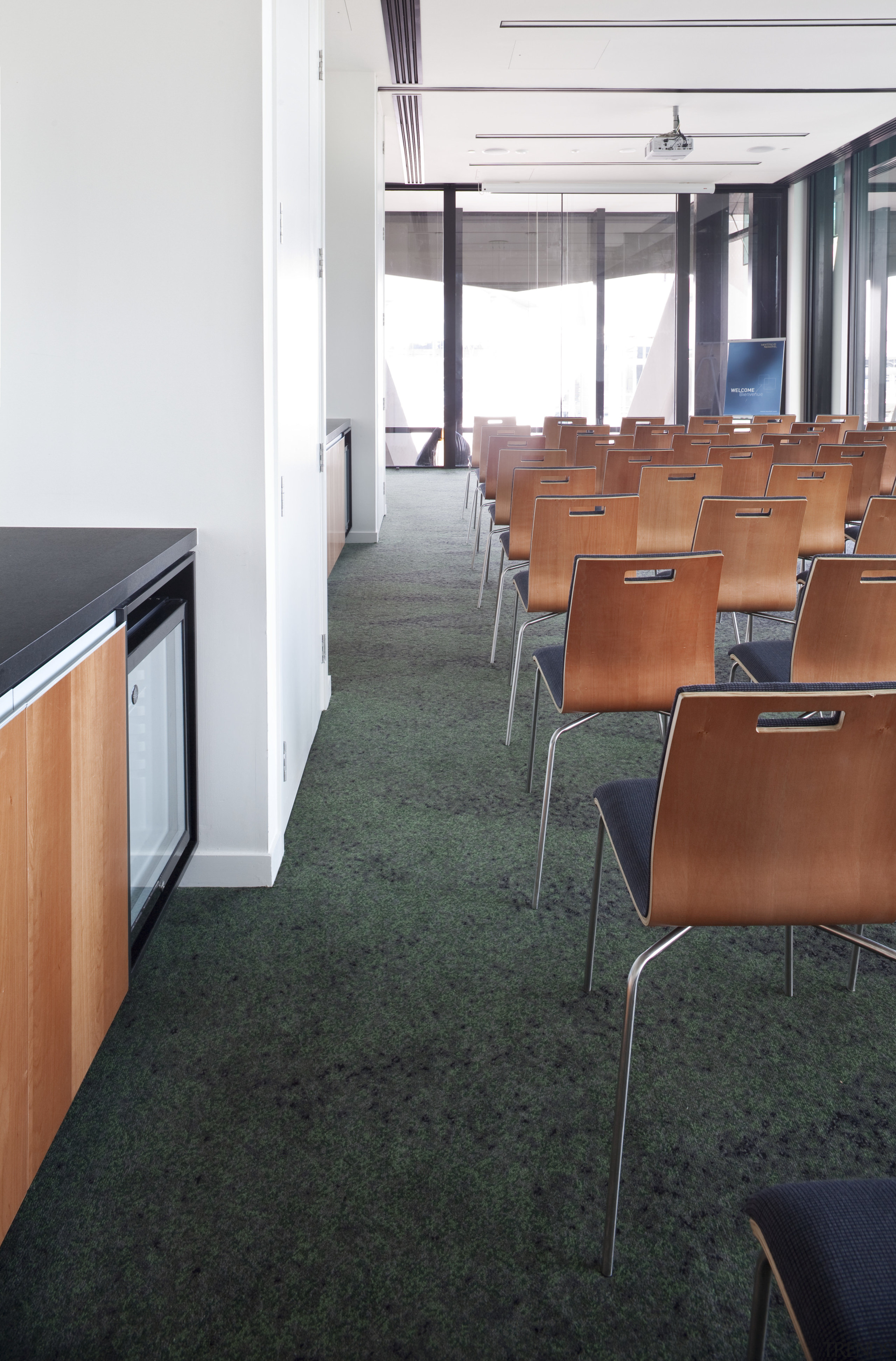 Interior of the Novotel Auckland Airport. Carpets supplied architecture, chair, floor, flooring, furniture, office, table, black, white