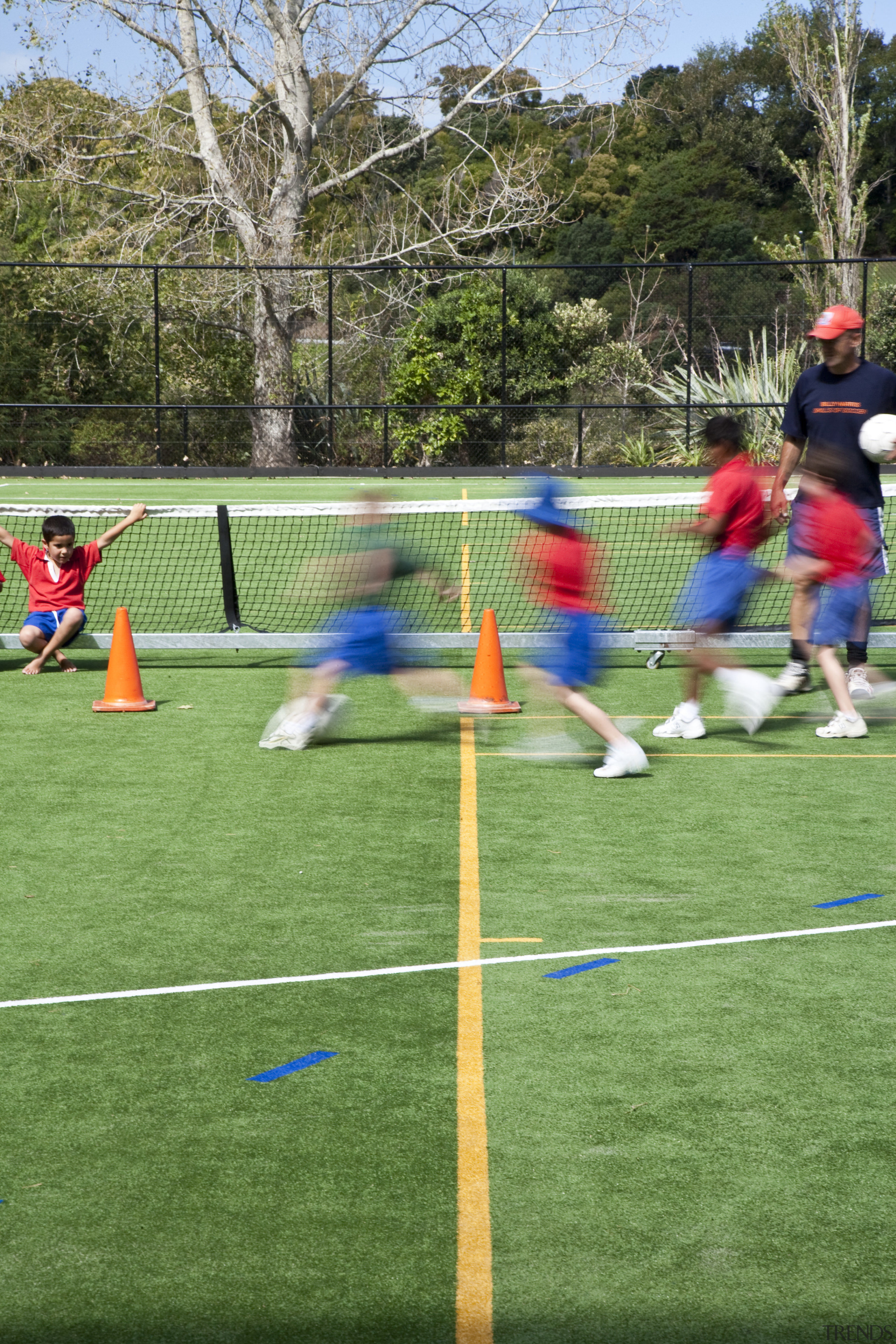 Exterior view of the St Kents' sporting facility artificial turf, ball, ball game, ball over a net games, competition, competition event, football, fun, games, grass, lawn, leisure, multi sport event, net, plant, play, player, playground, public space, recreation, sport venue, sports, sports equipment, sports training, team sport, tournament, green