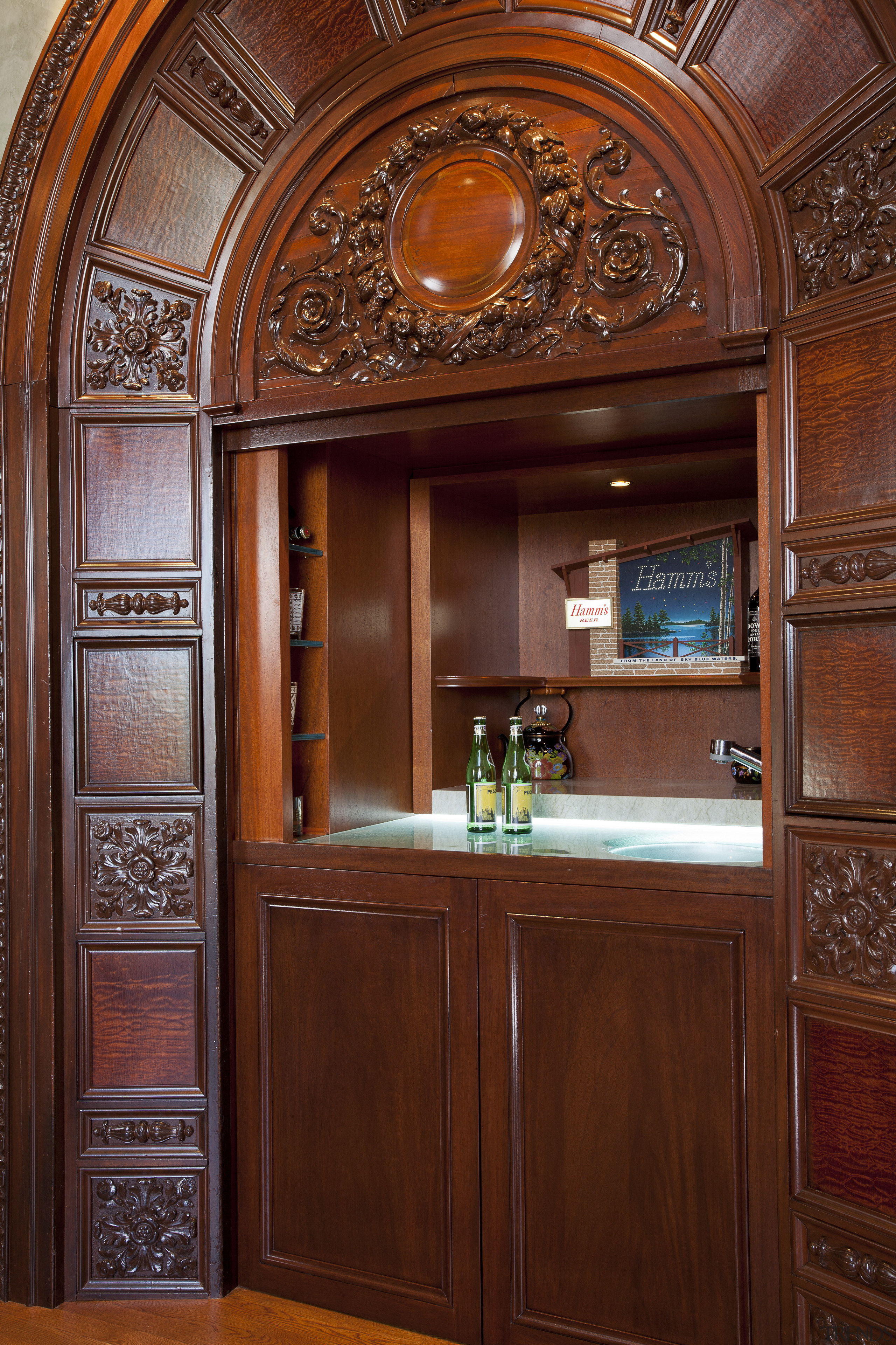 Inspired by classic childrens stories, this concealed retreat cabinetry, door, estate, interior design, wood, wood stain, red