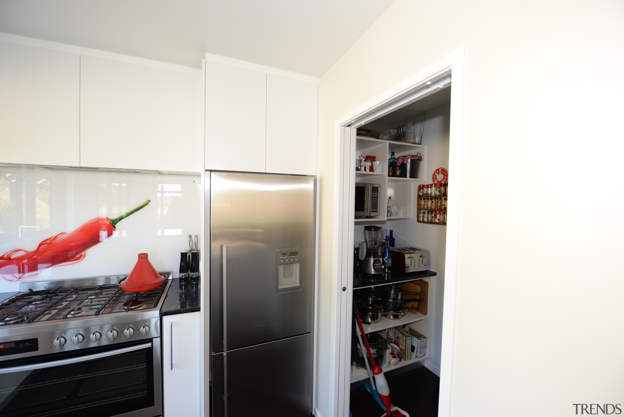 Kitchen design features red hot chilli splash back. interior design, room, white