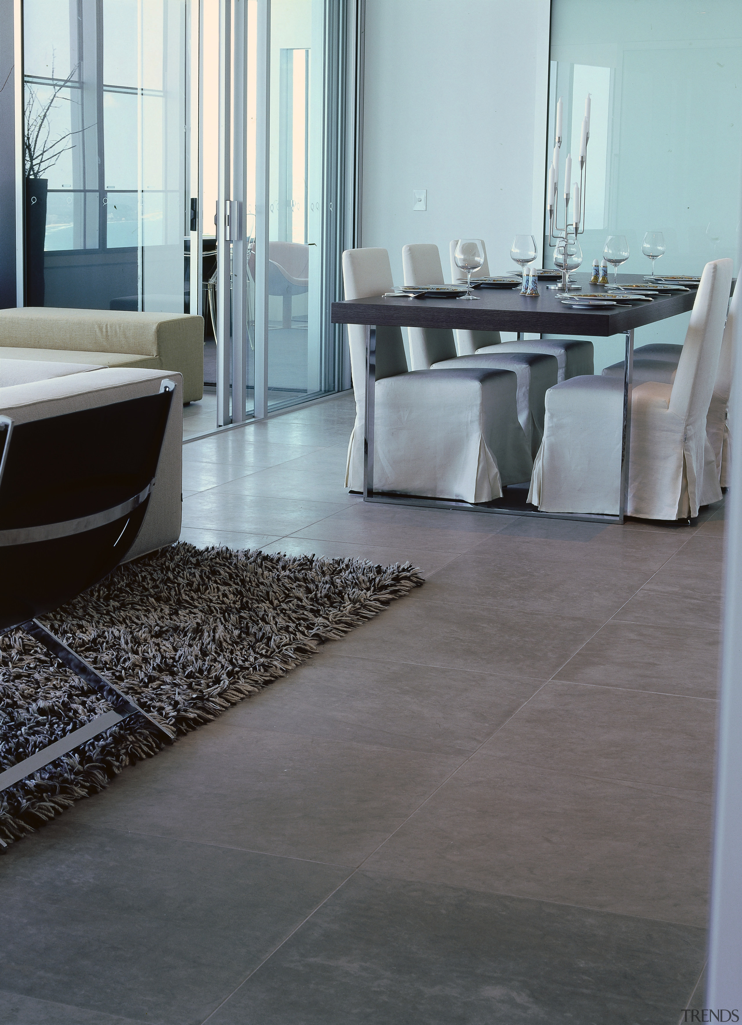 Apartment with natural limestone flooring, upholstered dining chairs floor, flooring, hardwood, interior design, laminate flooring, table, tile, wood, wood flooring, gray