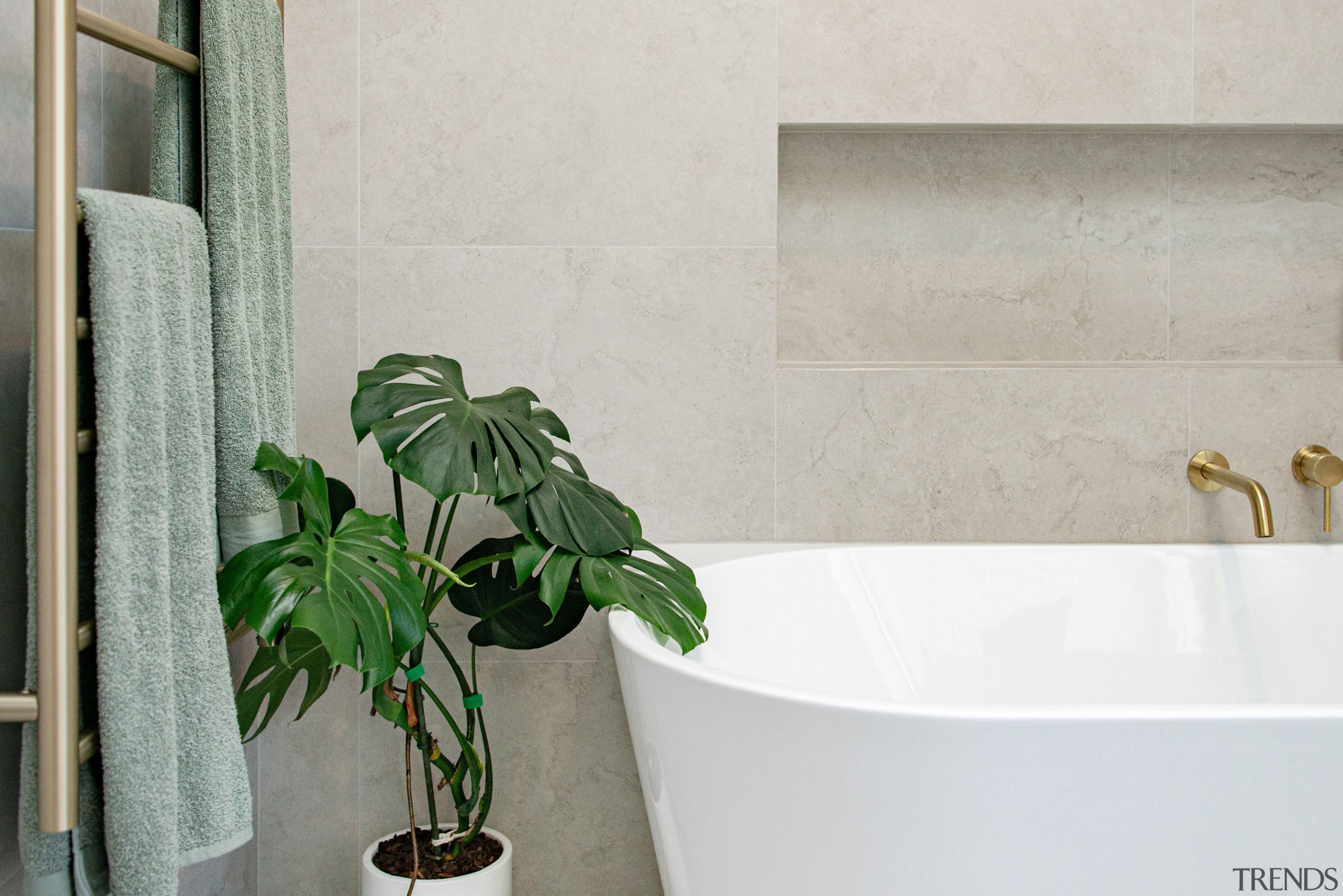 Master bathroom with back-to-the-wall tub, offering a look 