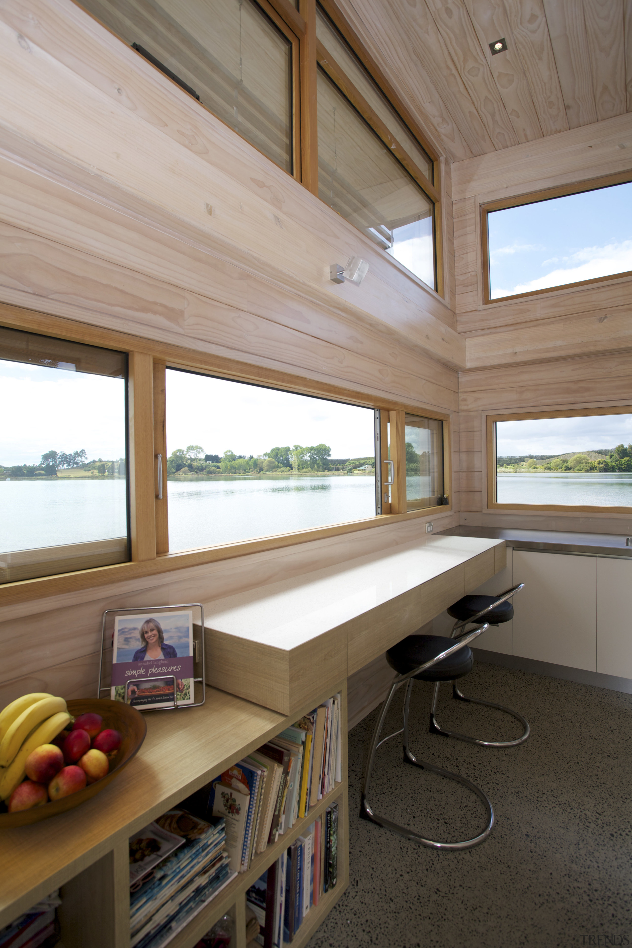 This workbench beneath a sliding window incorporates deep architecture, ceiling, daylighting, furniture, home, house, interior design, real estate, table, window, wood, brown, gray