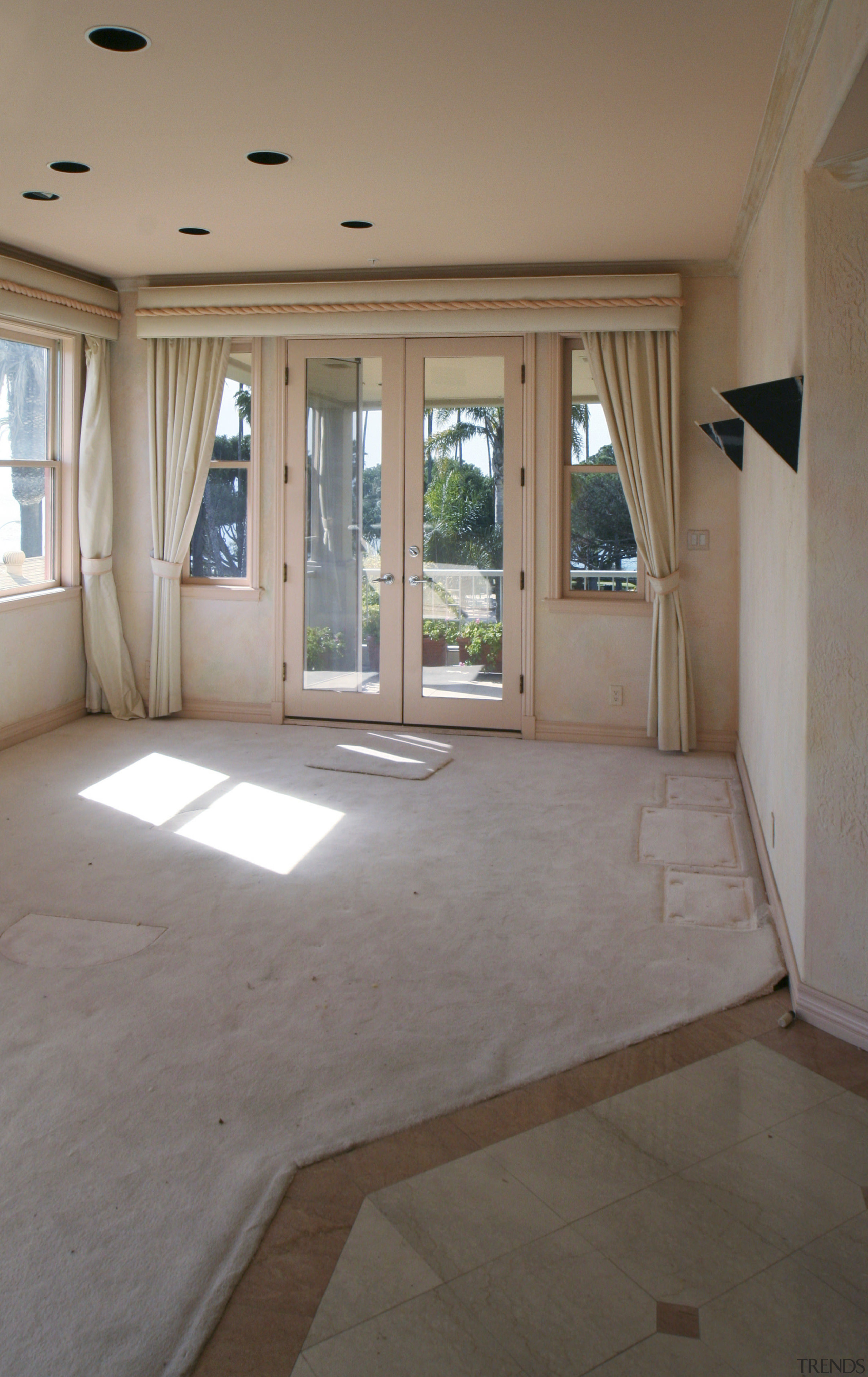 Interior view of this remodeled traditional condo by ceiling, daylighting, door, estate, floor, flooring, hardwood, home, house, interior design, laminate flooring, property, real estate, room, tile, wall, window, wood, wood flooring, gray, brown