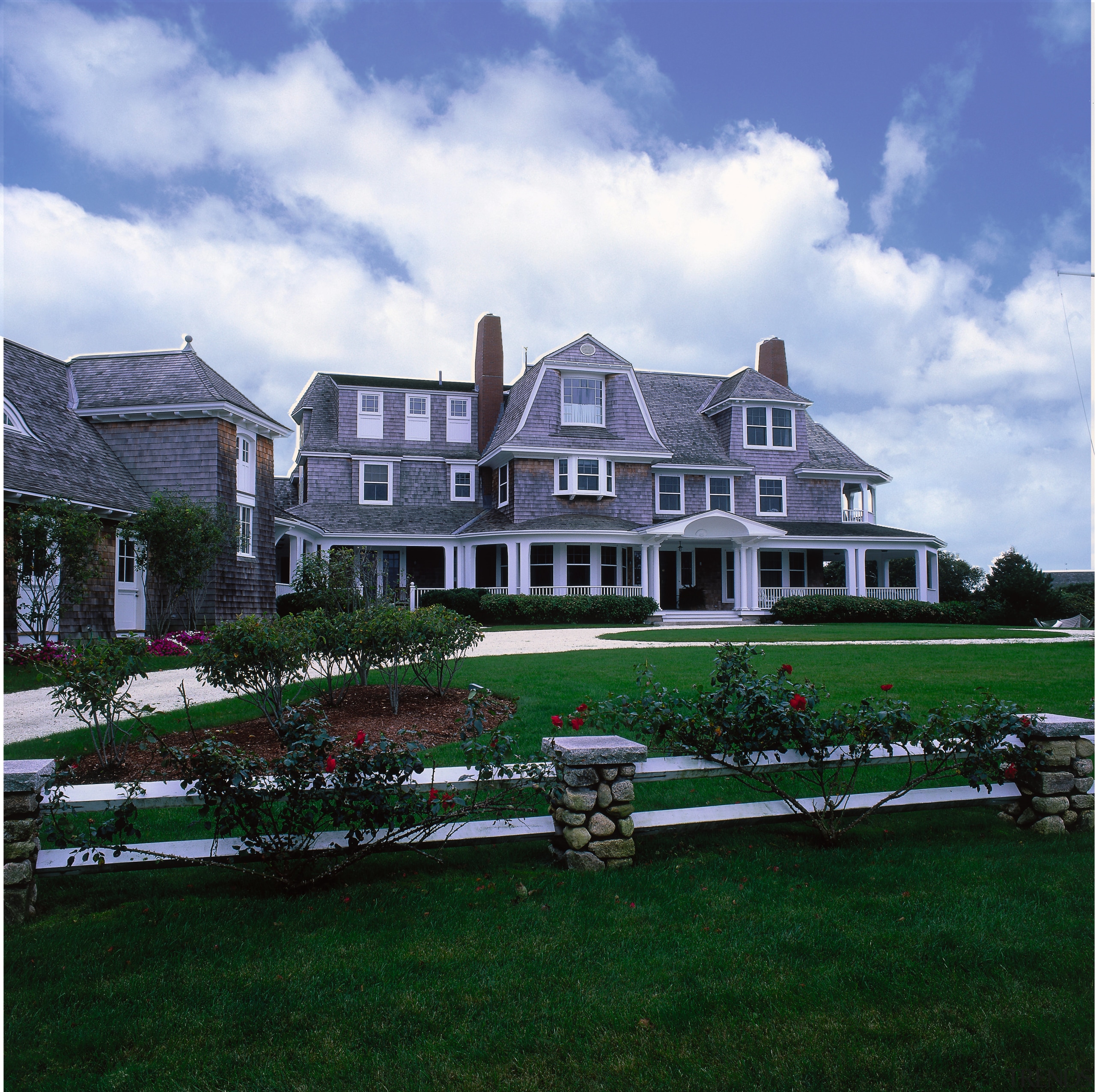 Exterior view of a vacation home, wooden shingles, cloud, cottage, estate, facade, farmhouse, grass, historic house, home, house, landscape, manor house, mansion, property, real estate, residential area, sky, suburb, villa, green, white