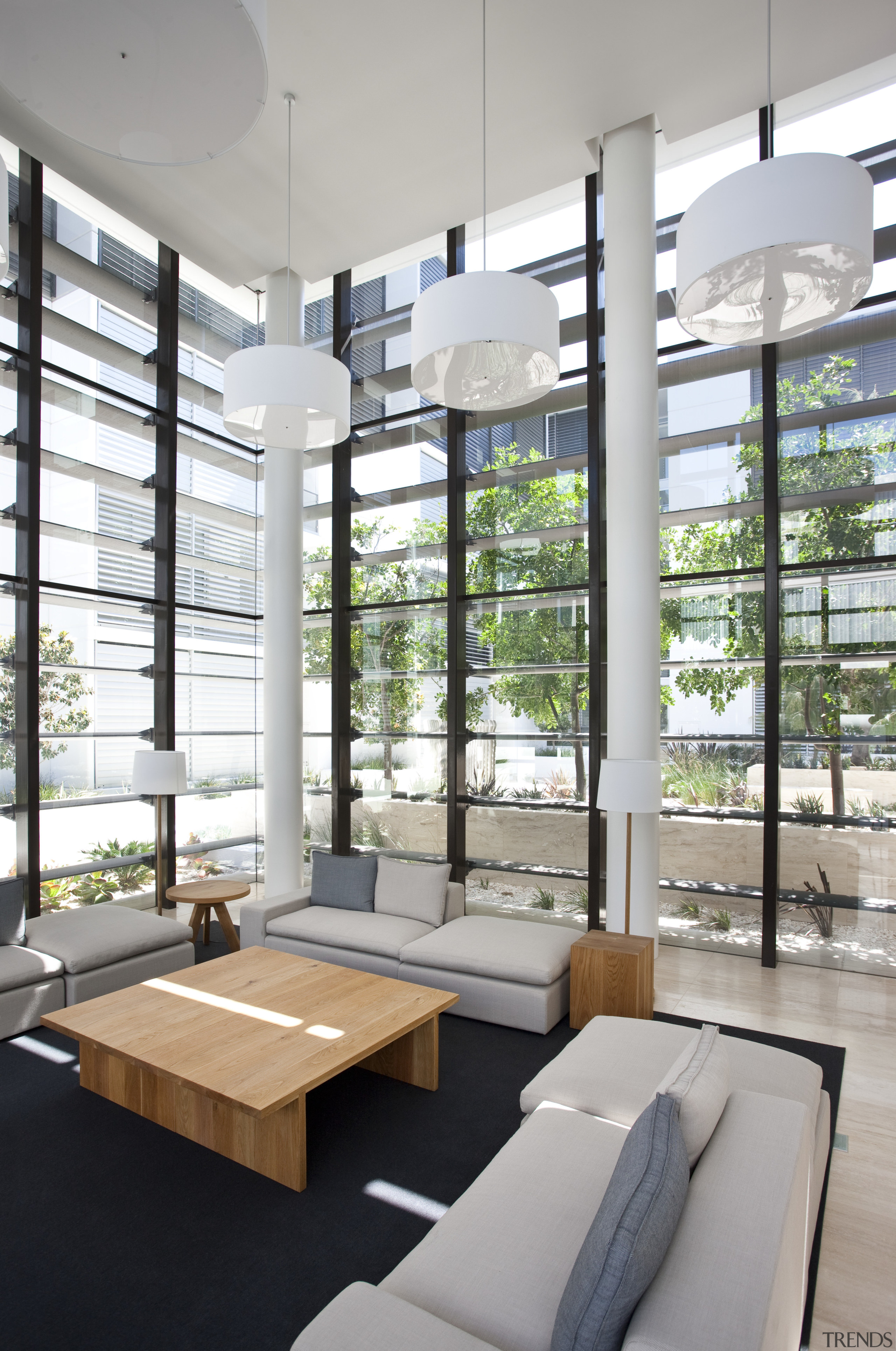 This precinct was developed by Mirvac. Here is architecture, daylighting, interior design, table, window, gray