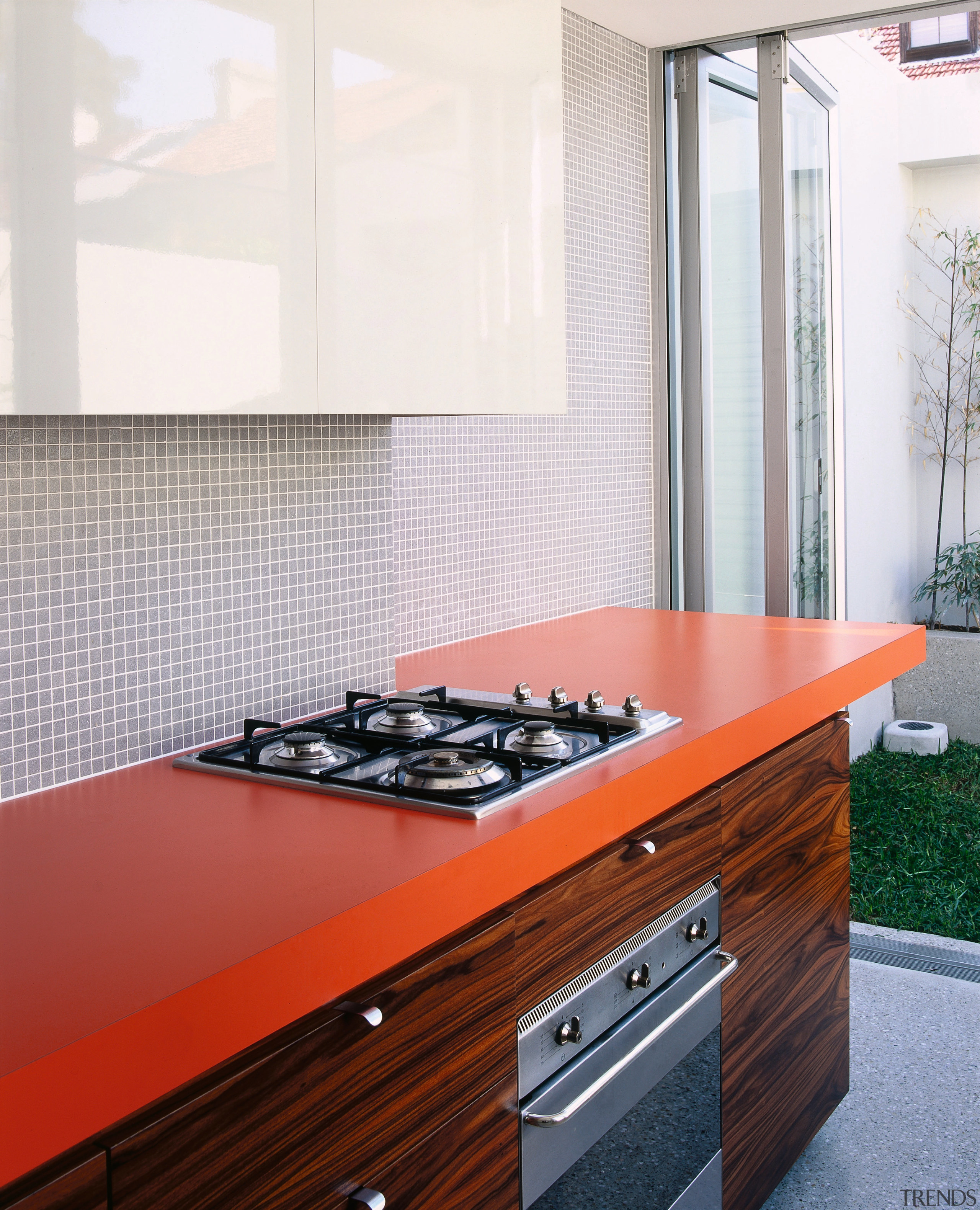 A view of a kitchen, wooden cabinetry, polished cabinetry, countertop, floor, flooring, interior design, kitchen, white