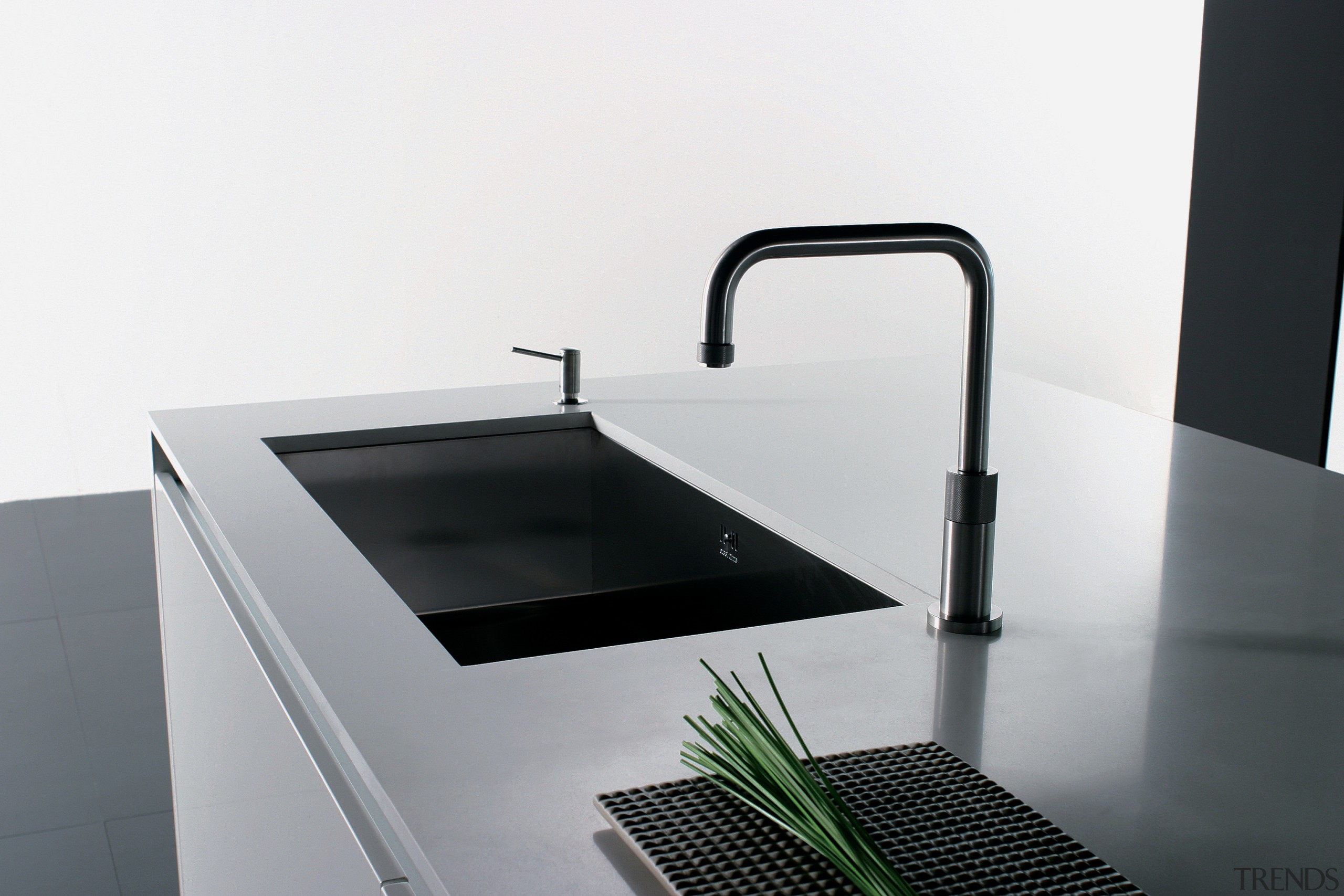 View of a contemporary kitchen which features countertops bathroom sink, hardware, plumbing fixture, product, product design, sink, tap, white, gray