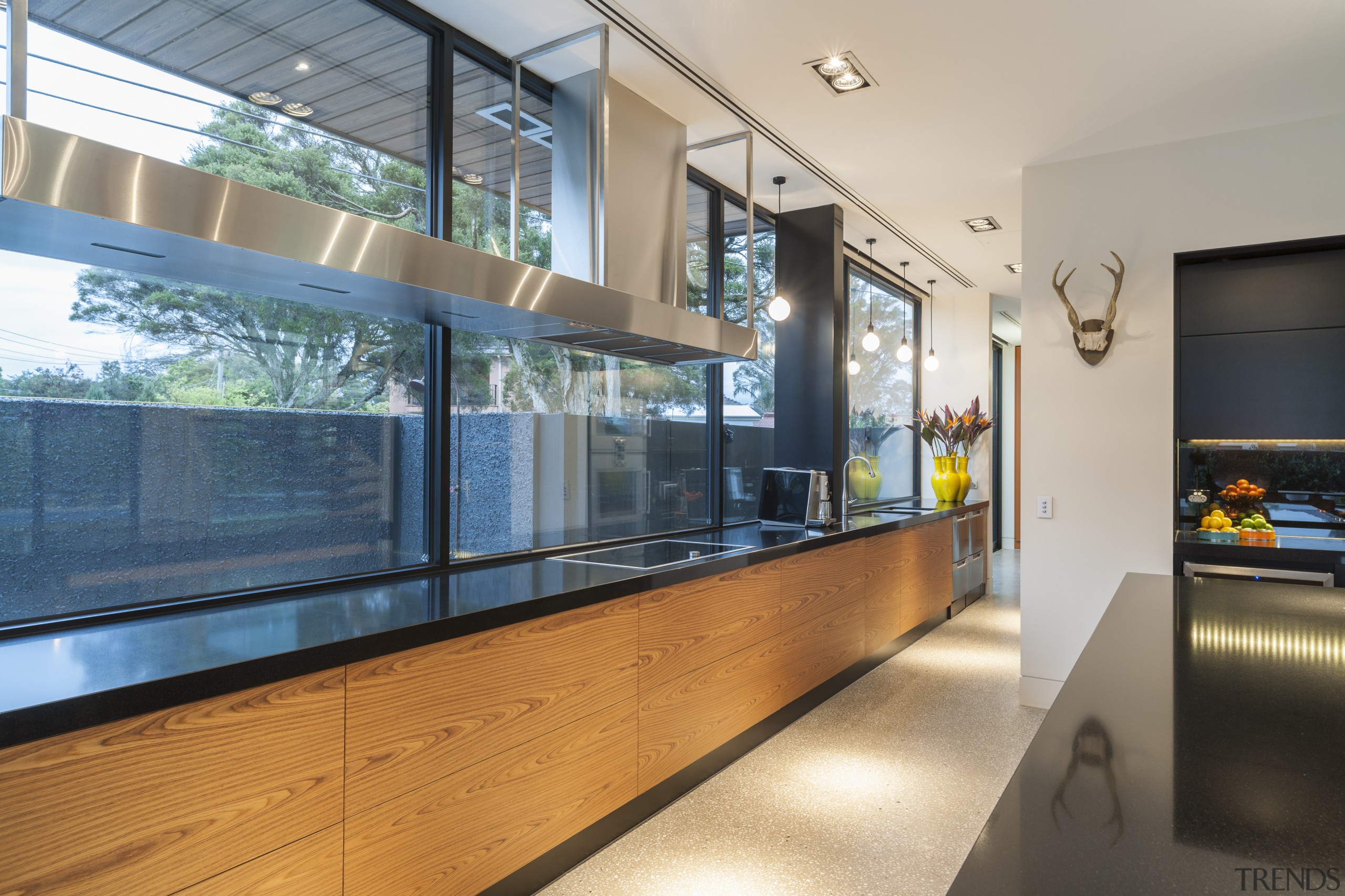 The cantilevered island countertop echoes the custom stainless glass, interior design, real estate, window, gray