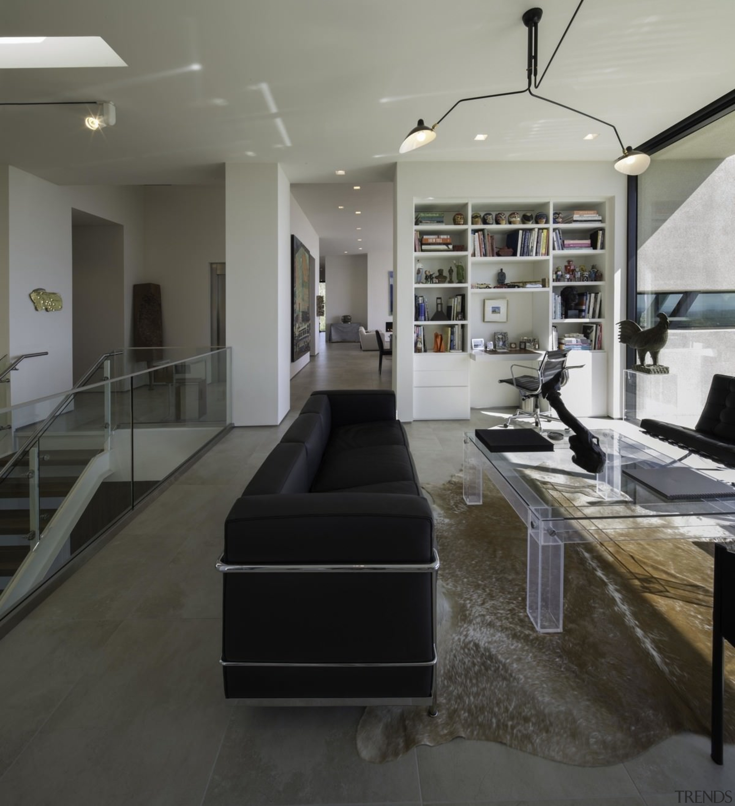 Carefully curated modernist furniture adds to the home's countertop, floor, flooring, interior design, black, gray