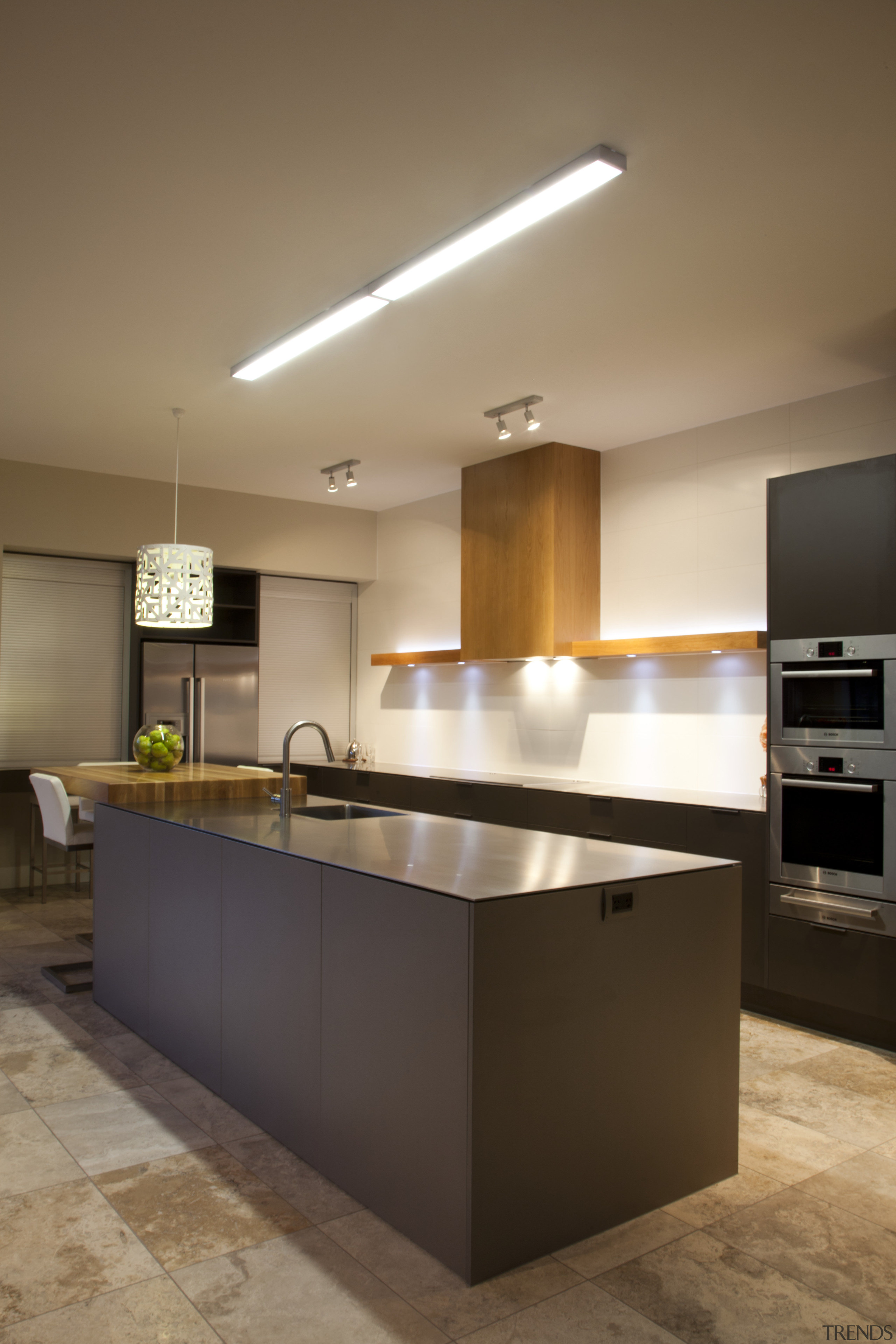 In this new kitchen, a breakfast bar in cabinetry, ceiling, countertop, cuisine classique, interior design, kitchen, room, under cabinet lighting, brown