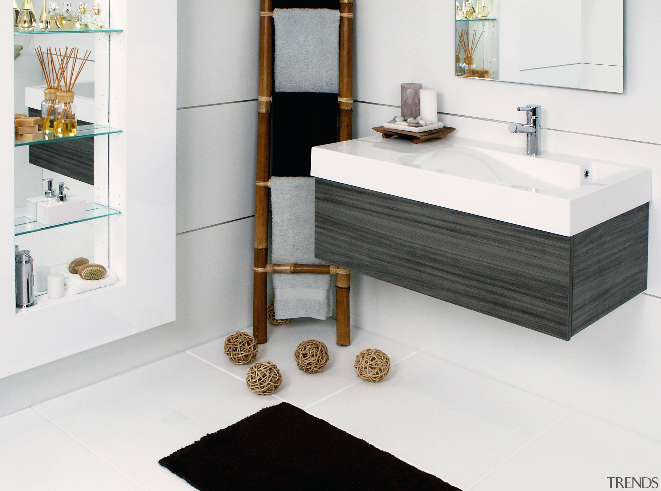 View of this bathroom featuring white cabinetry, stainless bathroom, bathroom accessory, bathroom cabinet, bathroom sink, chest of drawers, floor, flooring, furniture, interior design, plumbing fixture, product, product design, room, sink, tap, white