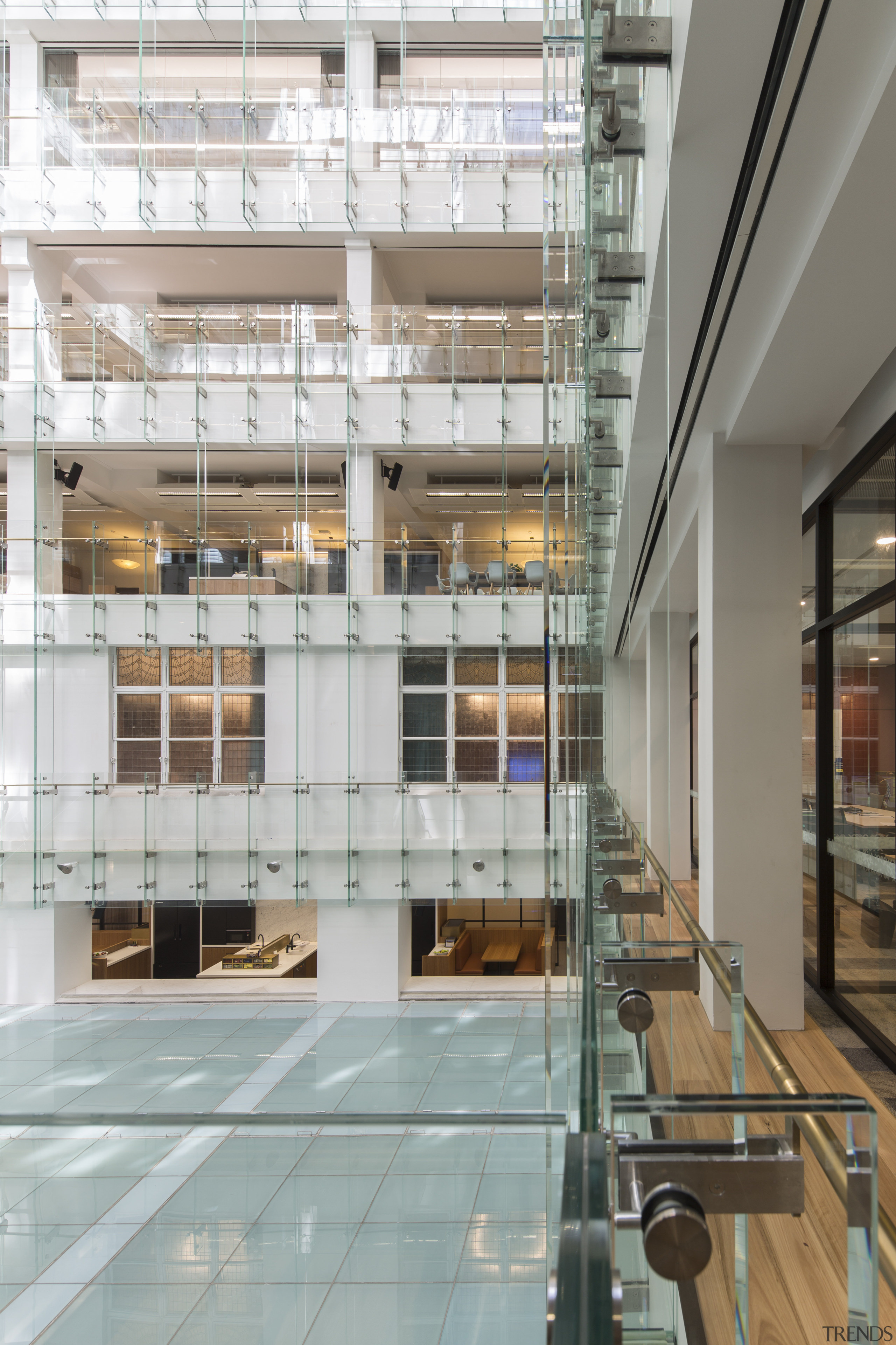 Looking into the office floors on the new apartment, architecture, building, condominium, daylighting, facade, glass, interior design, lobby, mixed use, real estate, gray
