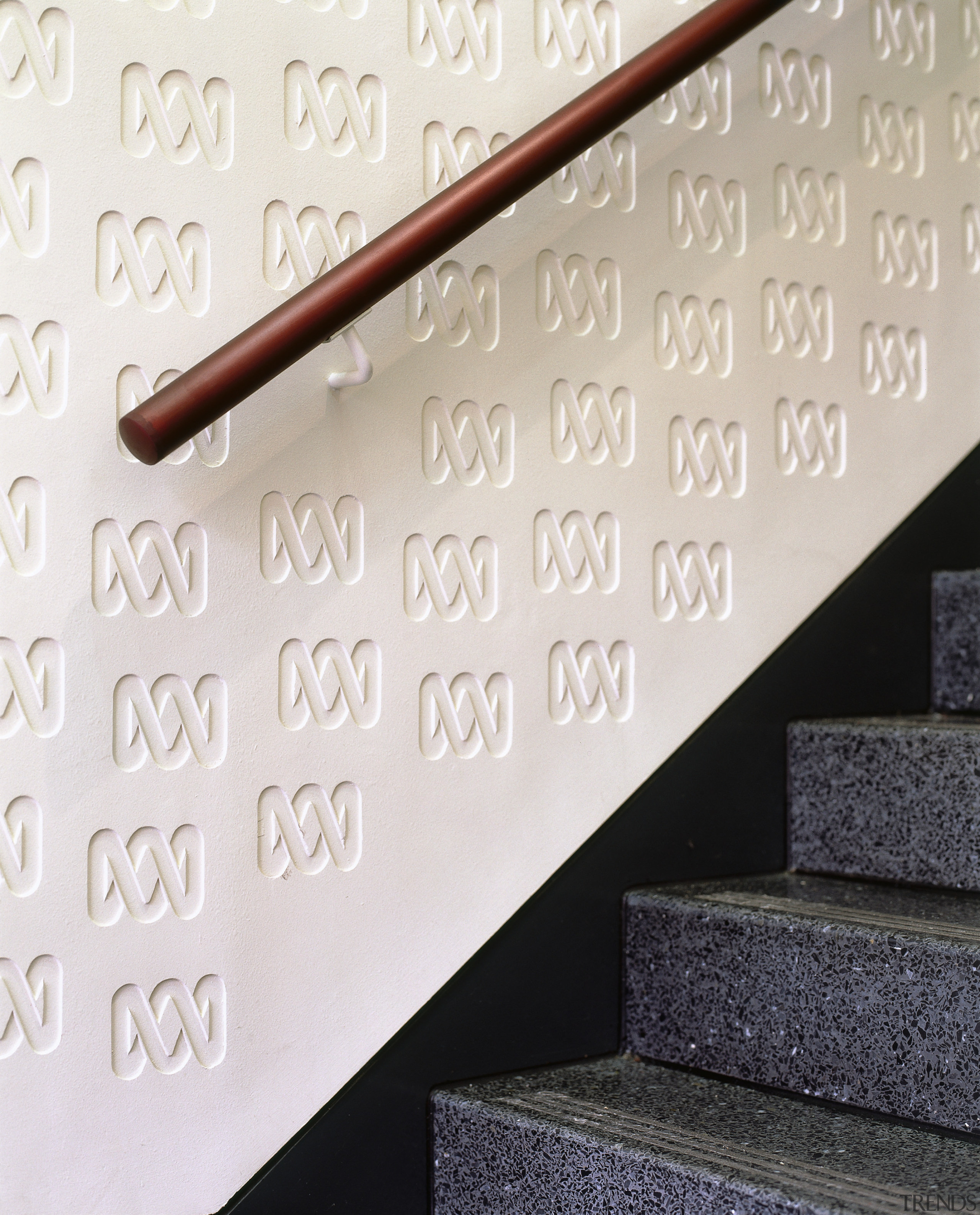 Stairway with ornate plaster panel on wall. - font, product design, wall, white