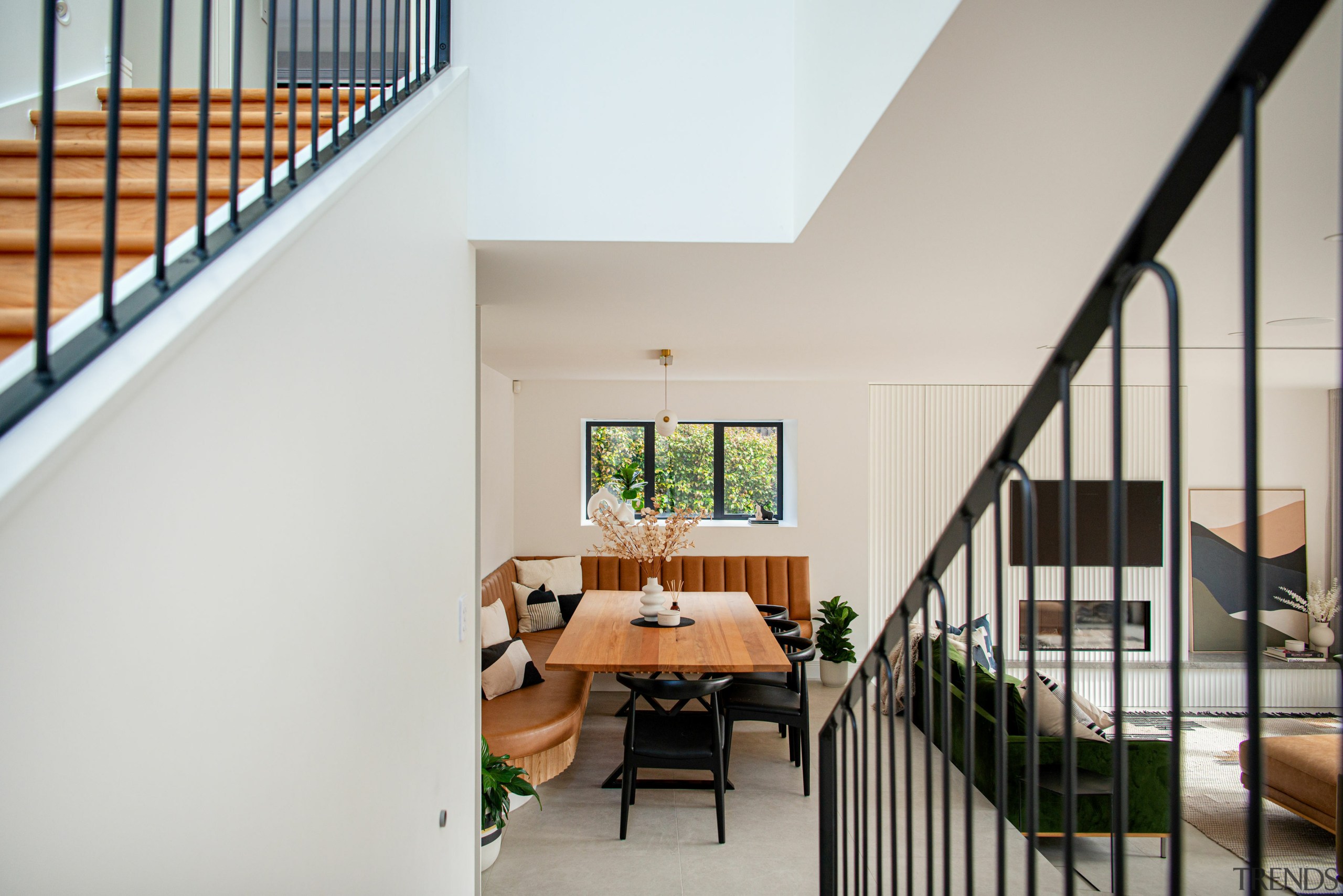 Elegant stairs draw you down through the space 