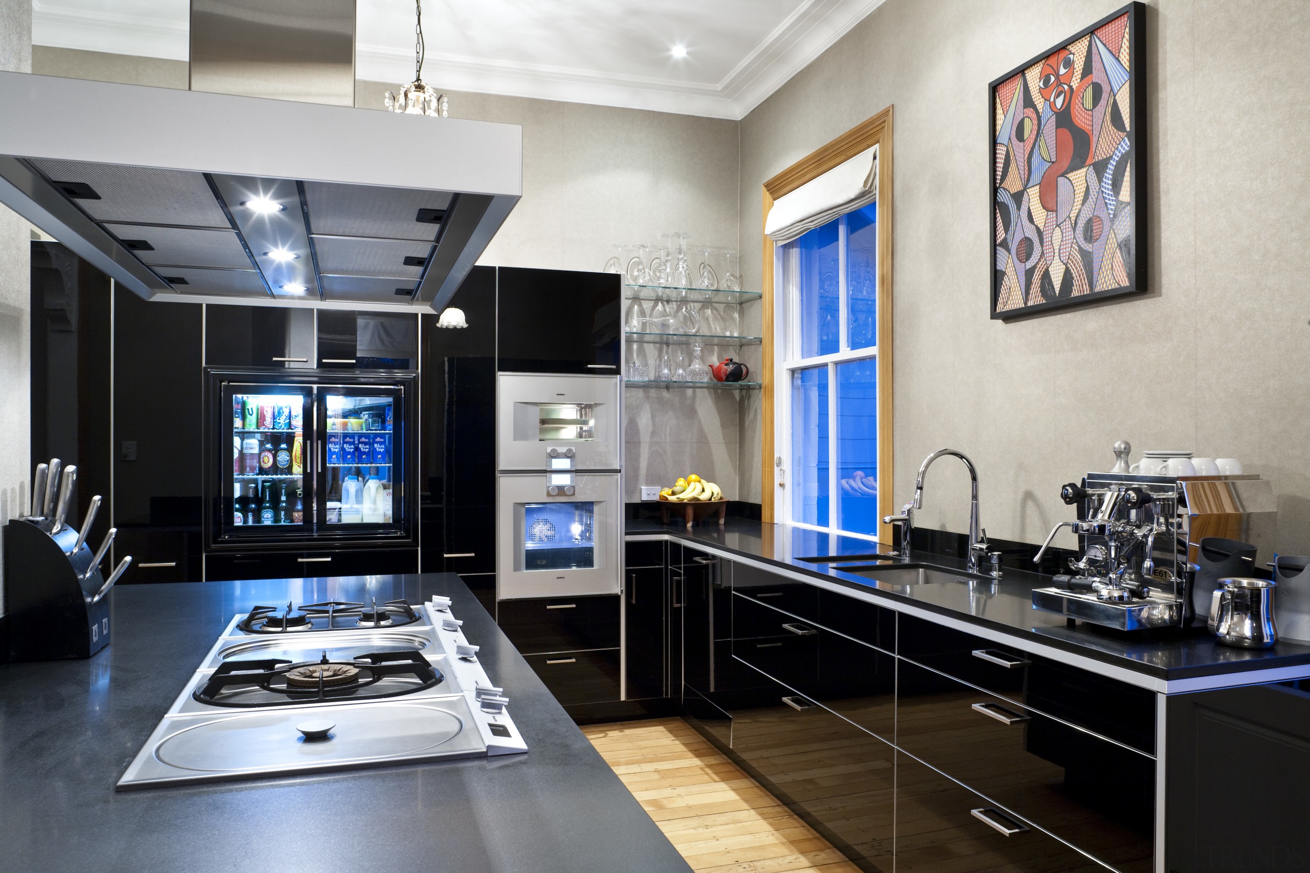 View of contemporary kitchen with dark cabinets and countertop, home appliance, interior design, kitchen, gray, black