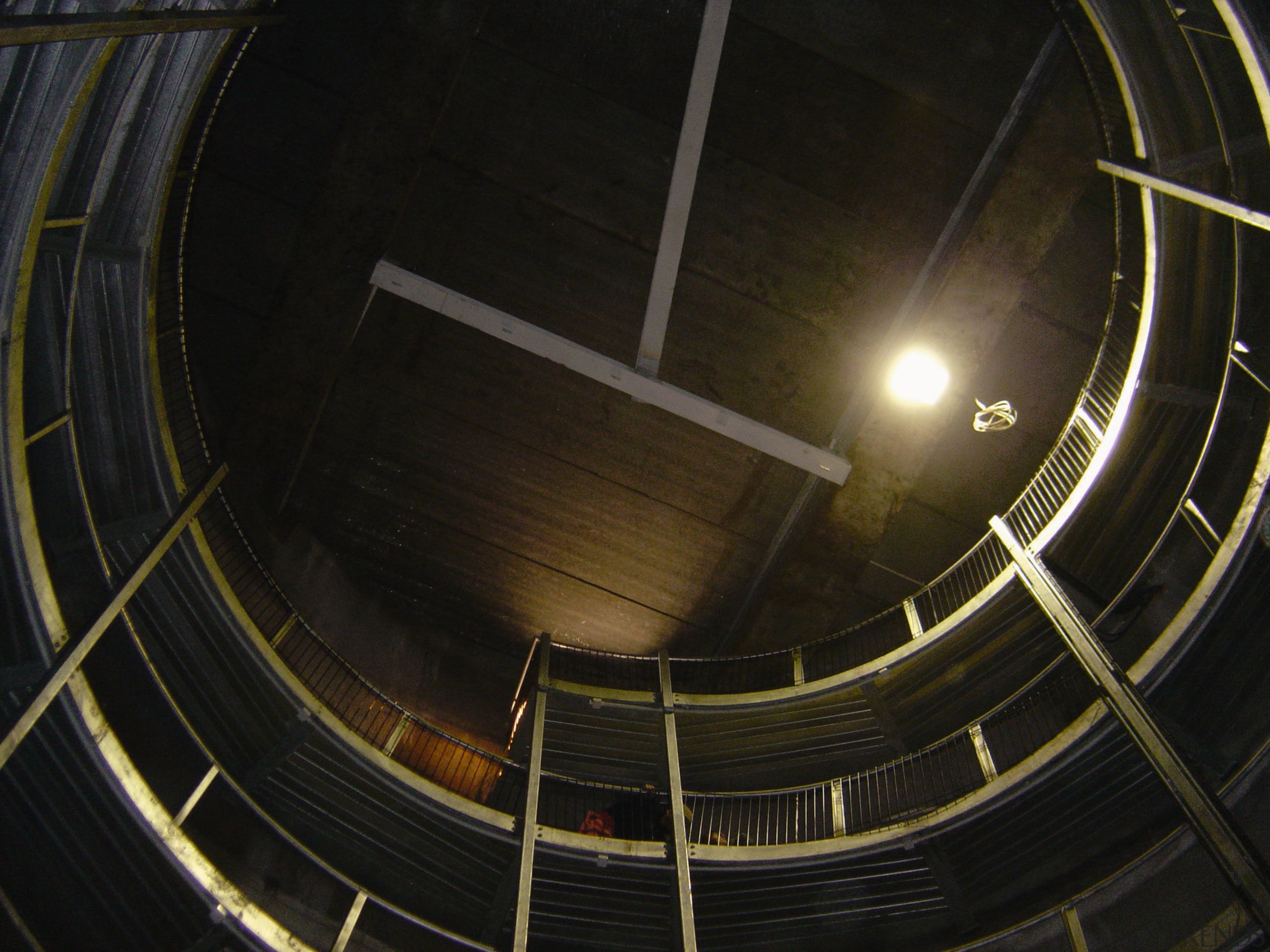 A view of some engineering work within a circle, darkness, daylighting, light, line, night, structure, black