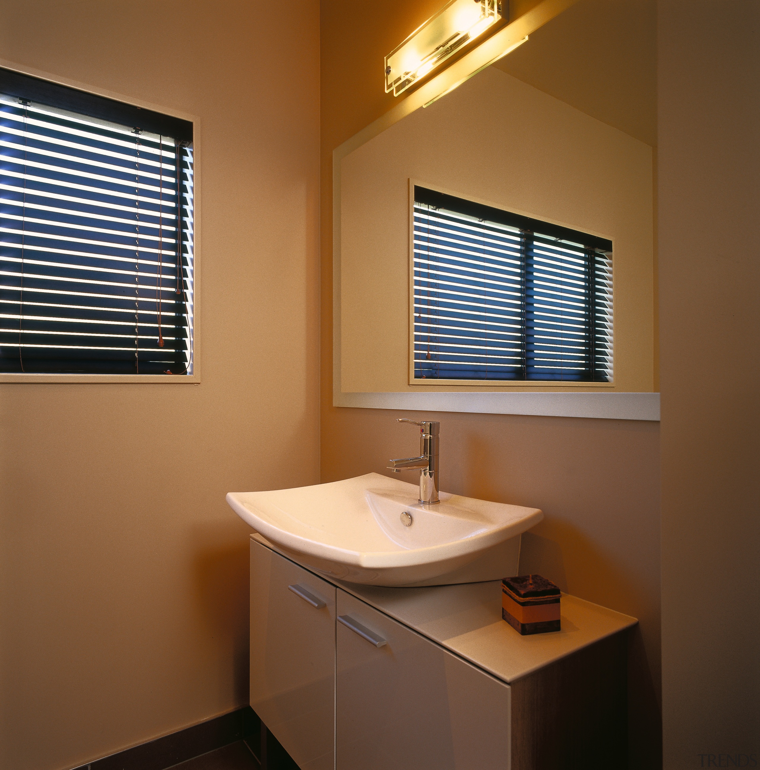 Bathroom with curved white basin on cream vanity, bathroom, bathroom accessory, daylighting, home, interior design, room, window, window blind, window covering, window treatment, brown