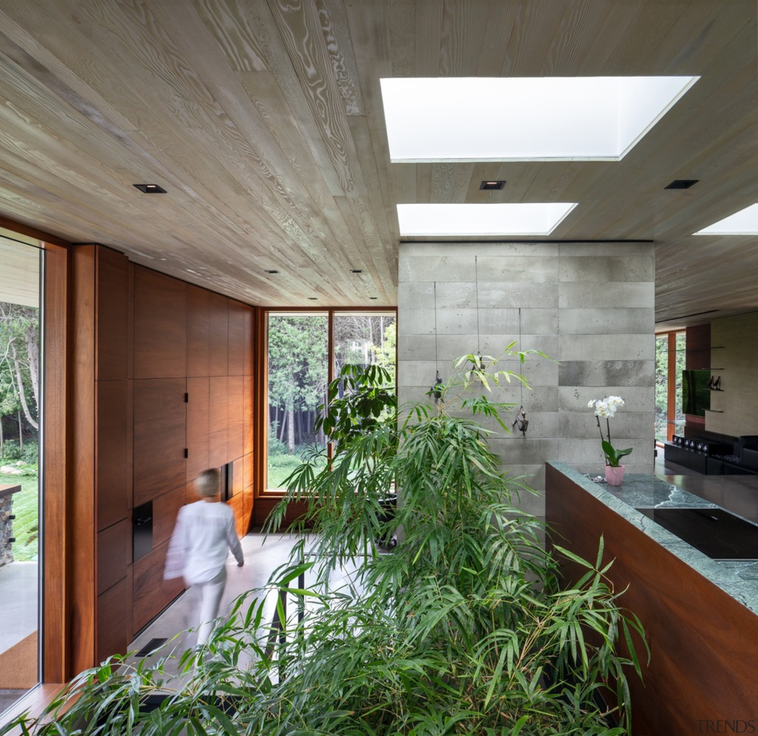 The entrance to tthe home is clad in architecture, building, ceiling, daylighting, floor, house, interior design, lobby, plant, real estate, room, gray