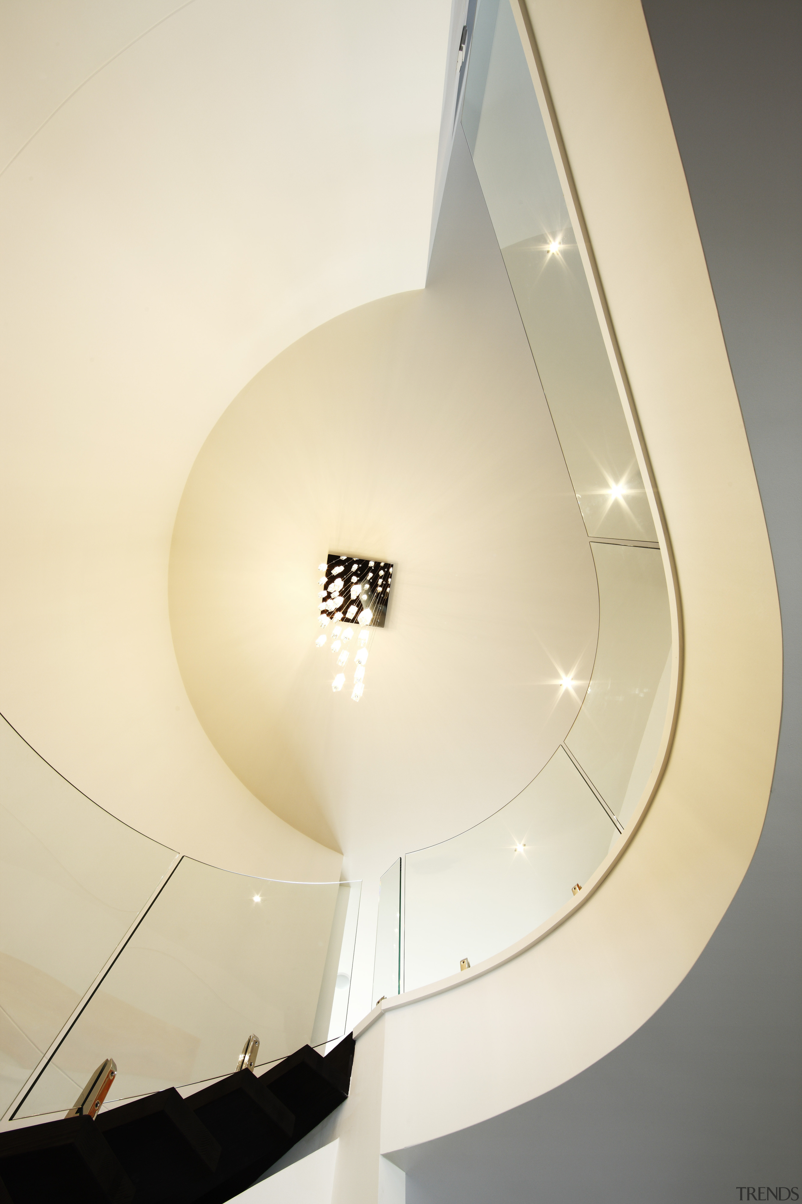 View of a stairway which features a curved ceiling, daylighting, lamp, light, light fixture, lighting, lighting accessory, product design, orange