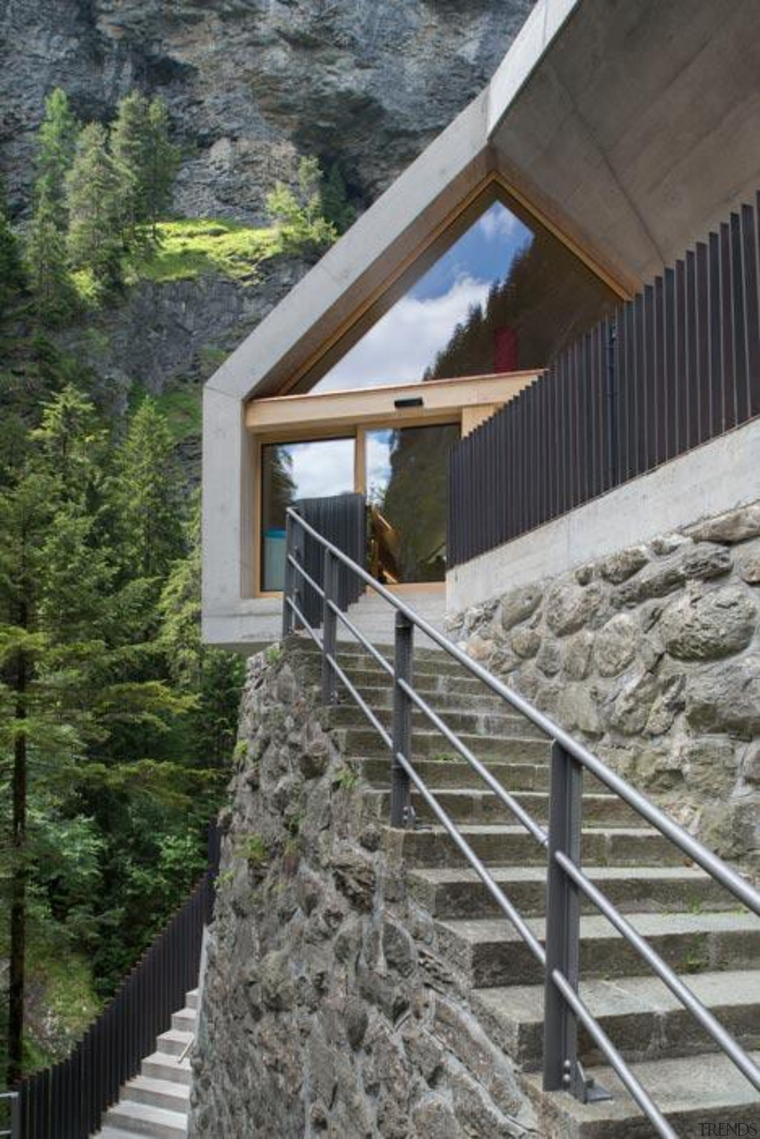 The visitor centre located at the top of architecture, cottage, facade, handrail, house, stairs, gray, black