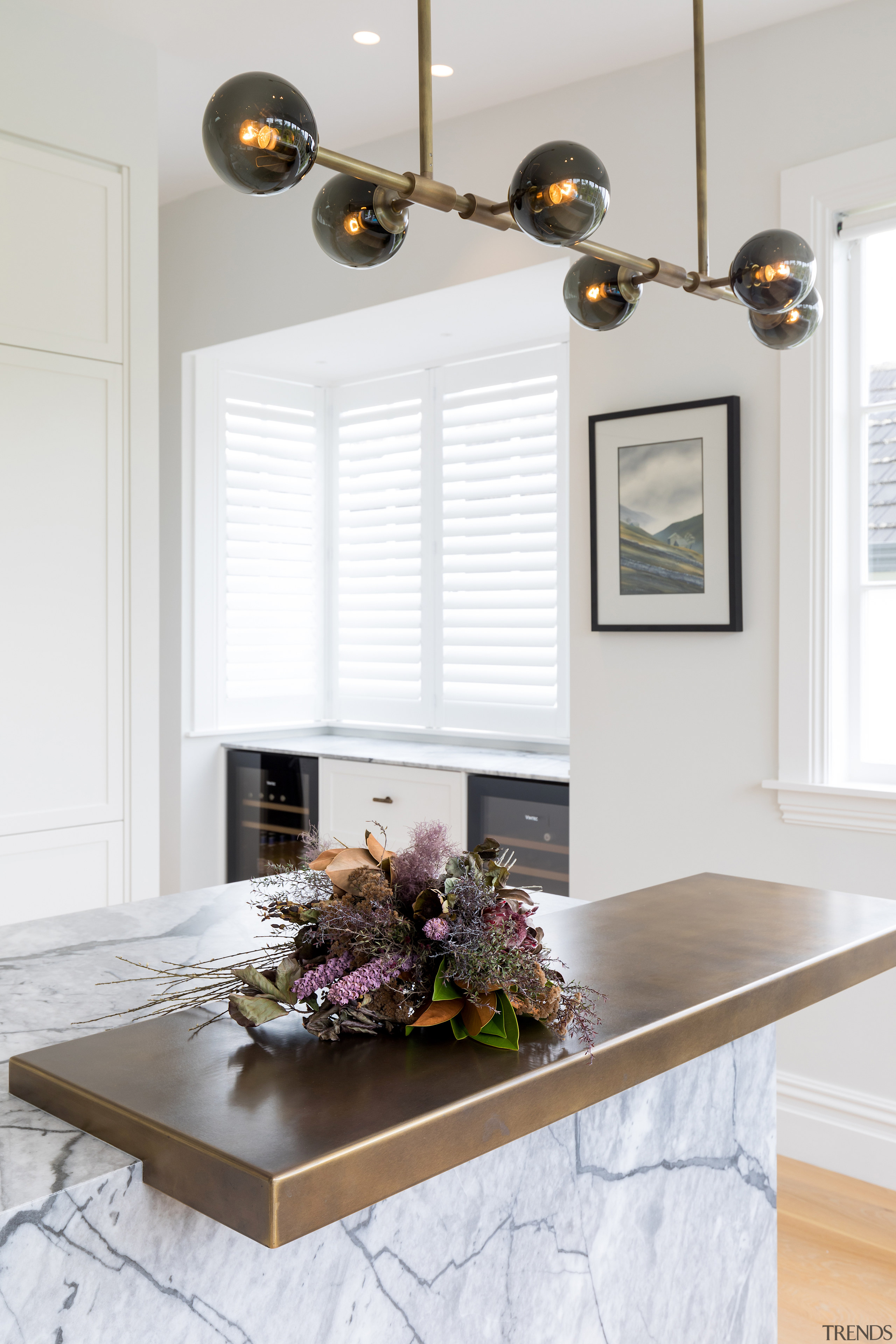 An aged brass pendant ties in with brass 