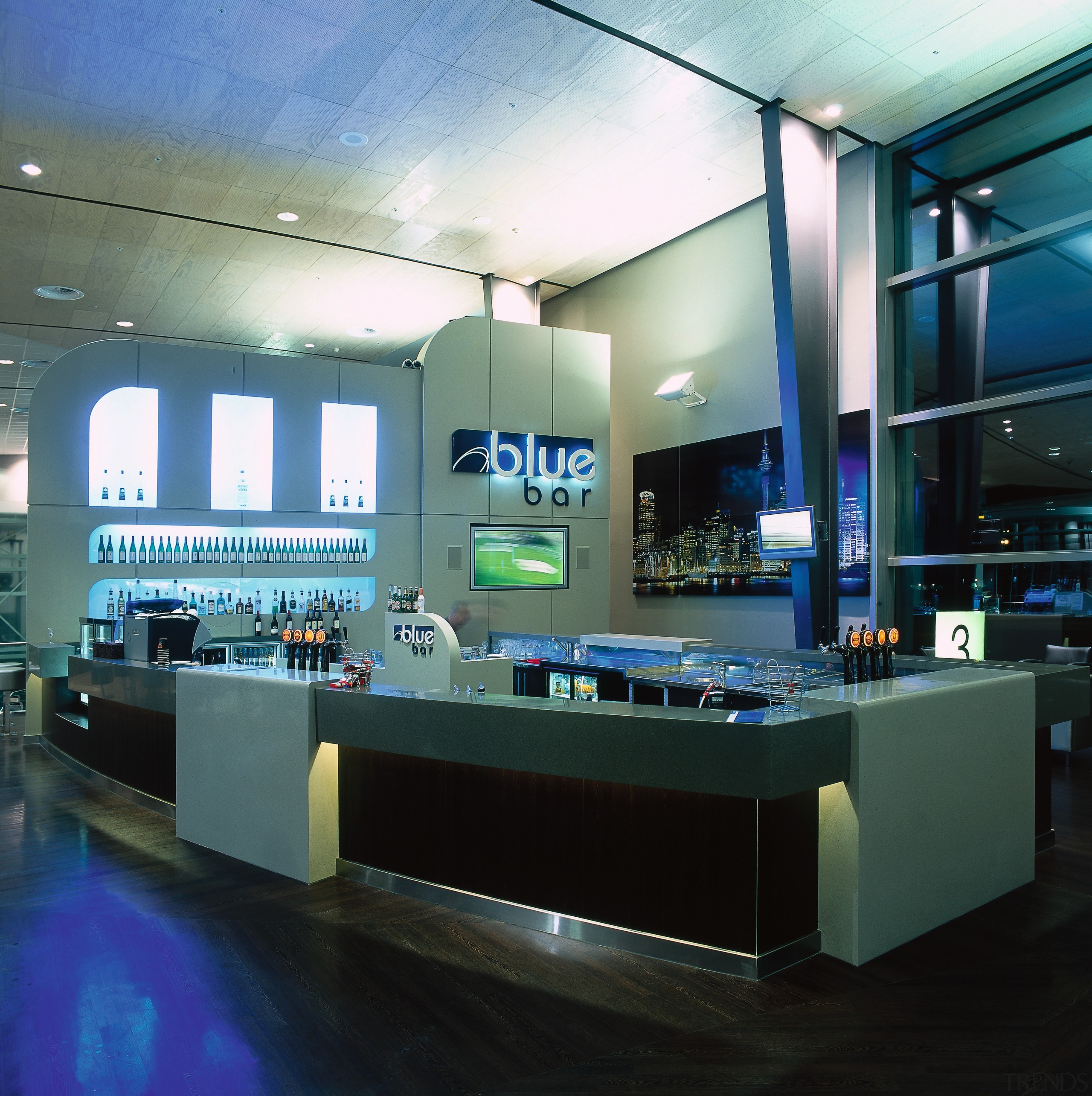 View of retail bar with neon lighting and interior design, black