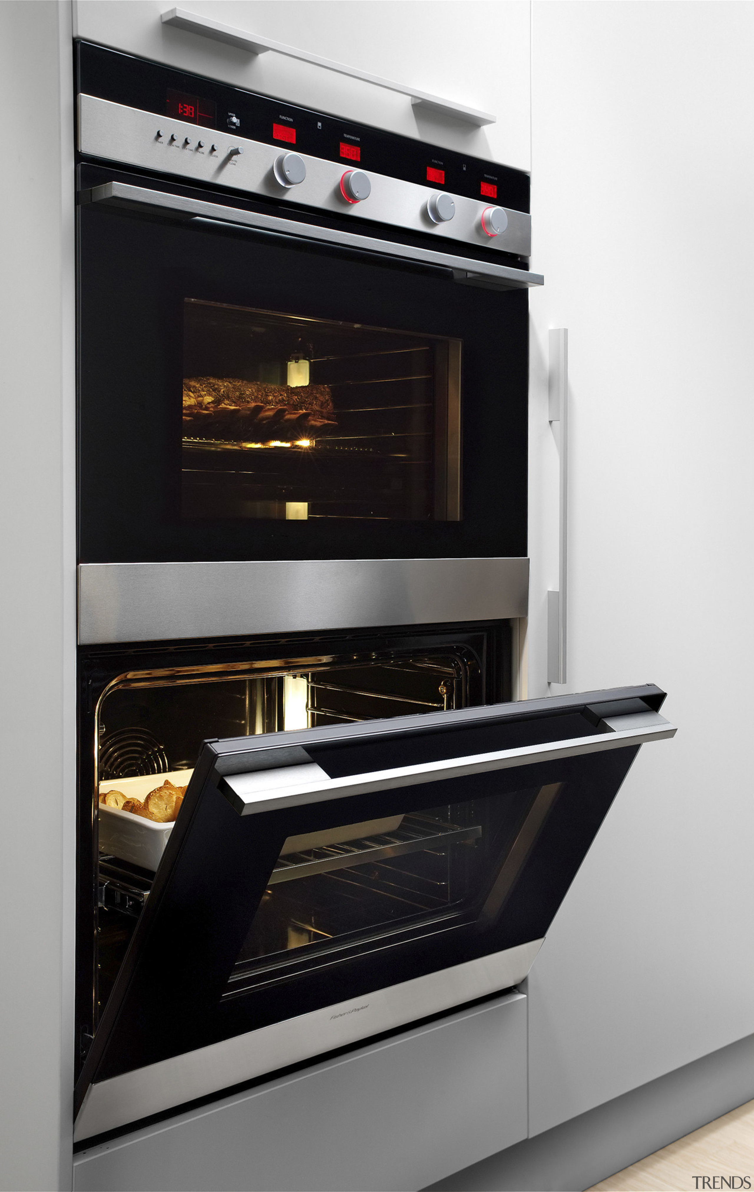 View of a kitchen which features a Fisher gas stove, home appliance, kitchen appliance, kitchen stove, major appliance, oven, black, white, gray