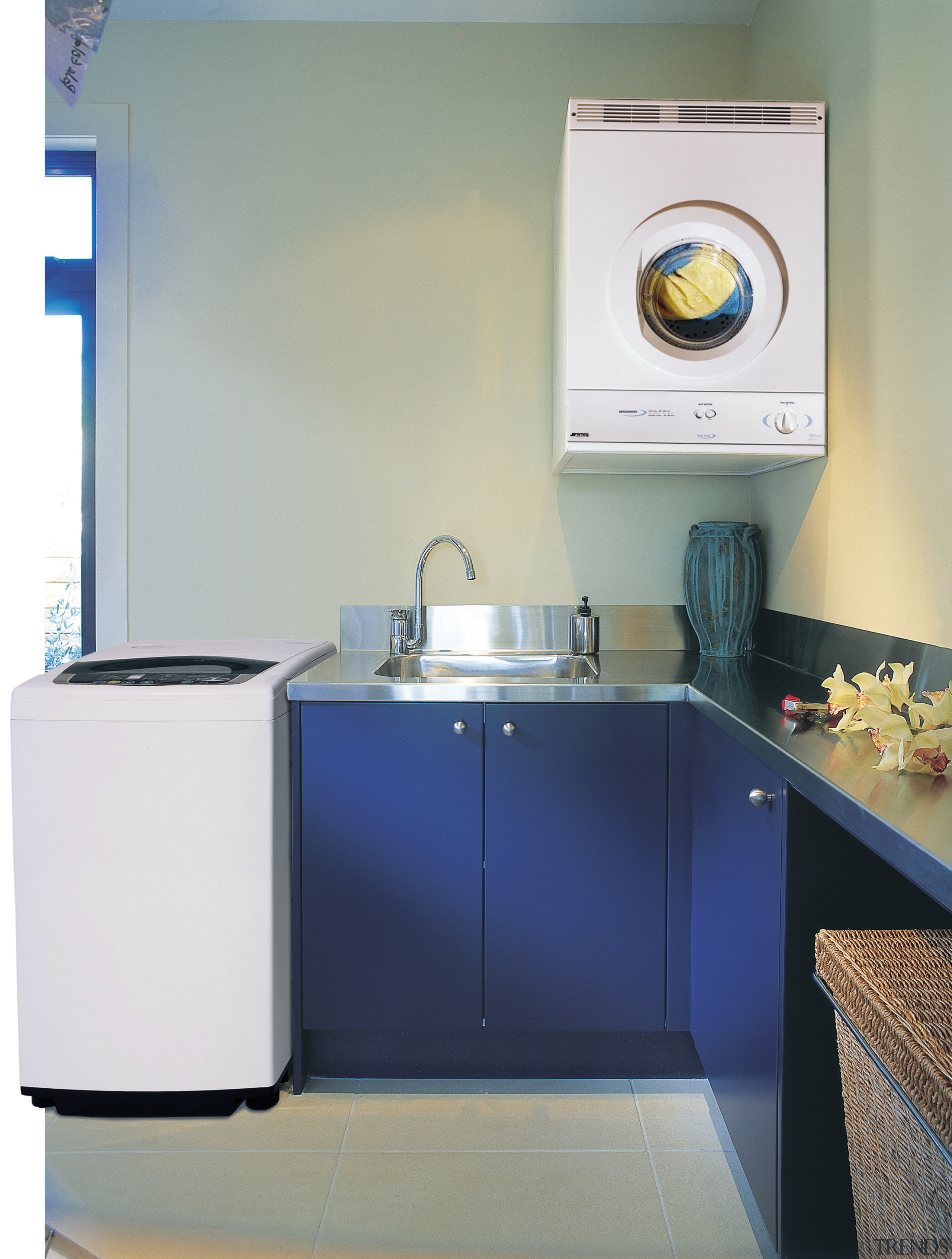 A laundry featuring a Smeg washing machine and bathroom, clothes dryer, home appliance, kitchen, laundry, laundry room, major appliance, product, product design, room, sink, washing machine, gray