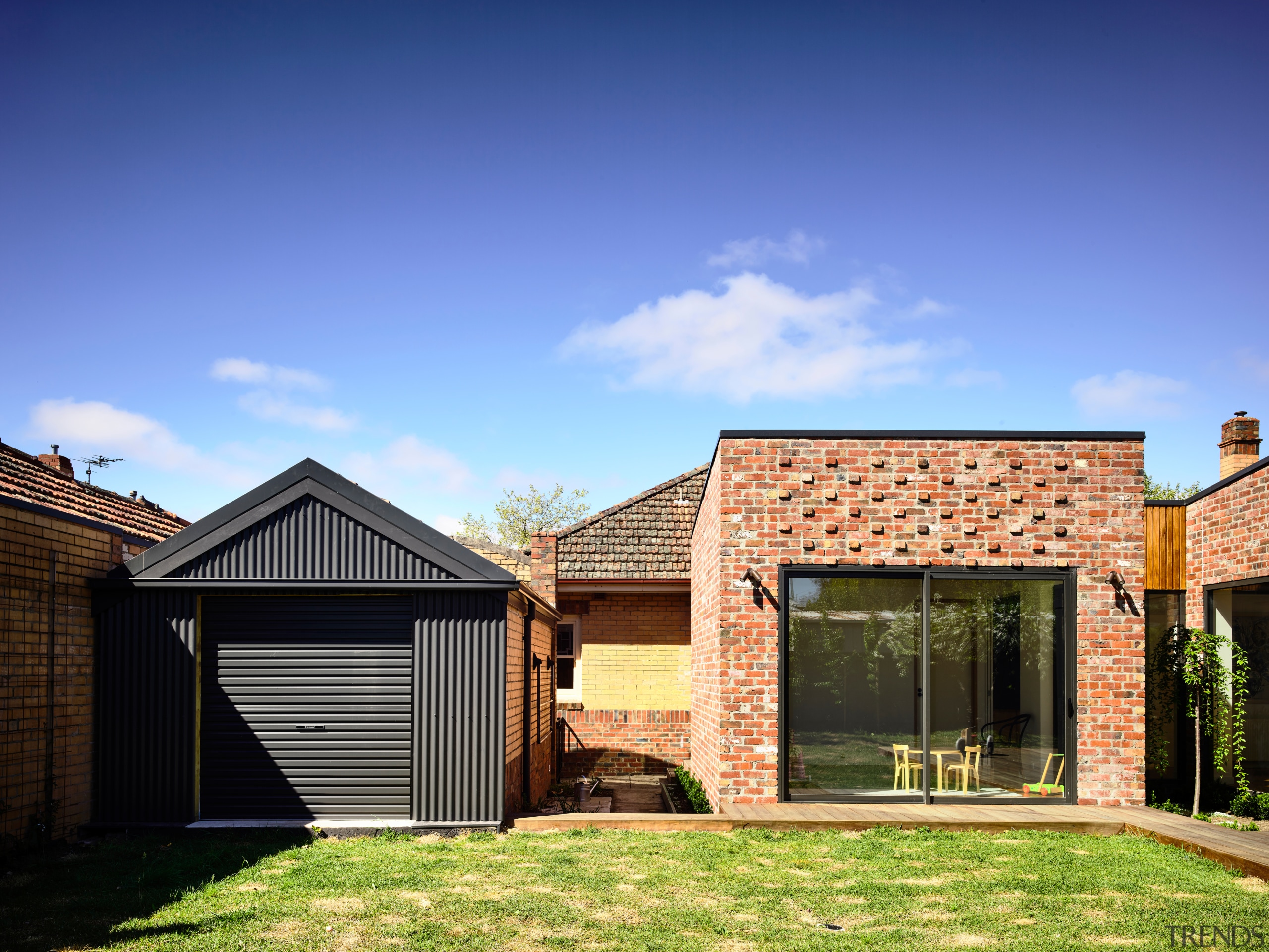 ​​​​​​​Black corrugated iron on the garage provides a backyard, elevation, facade, home, house, property, residential area, roof, shed, siding, extension, brick, Porter architectur