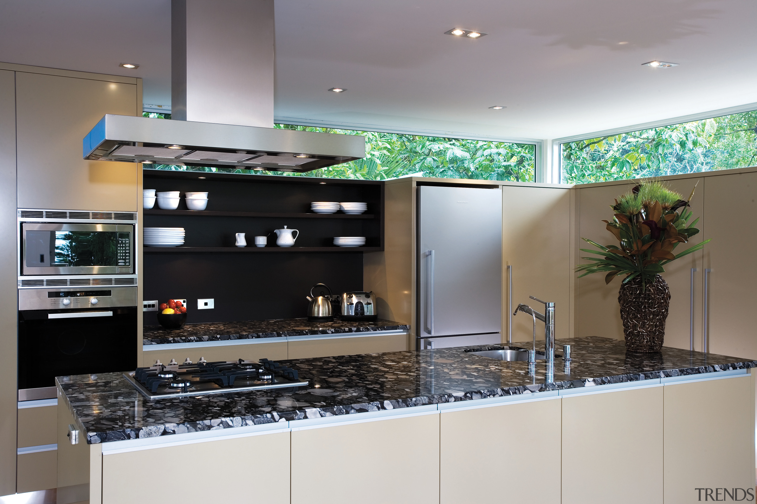 A view of this kitchen featuring polished timber countertop, interior design, kitchen, gray