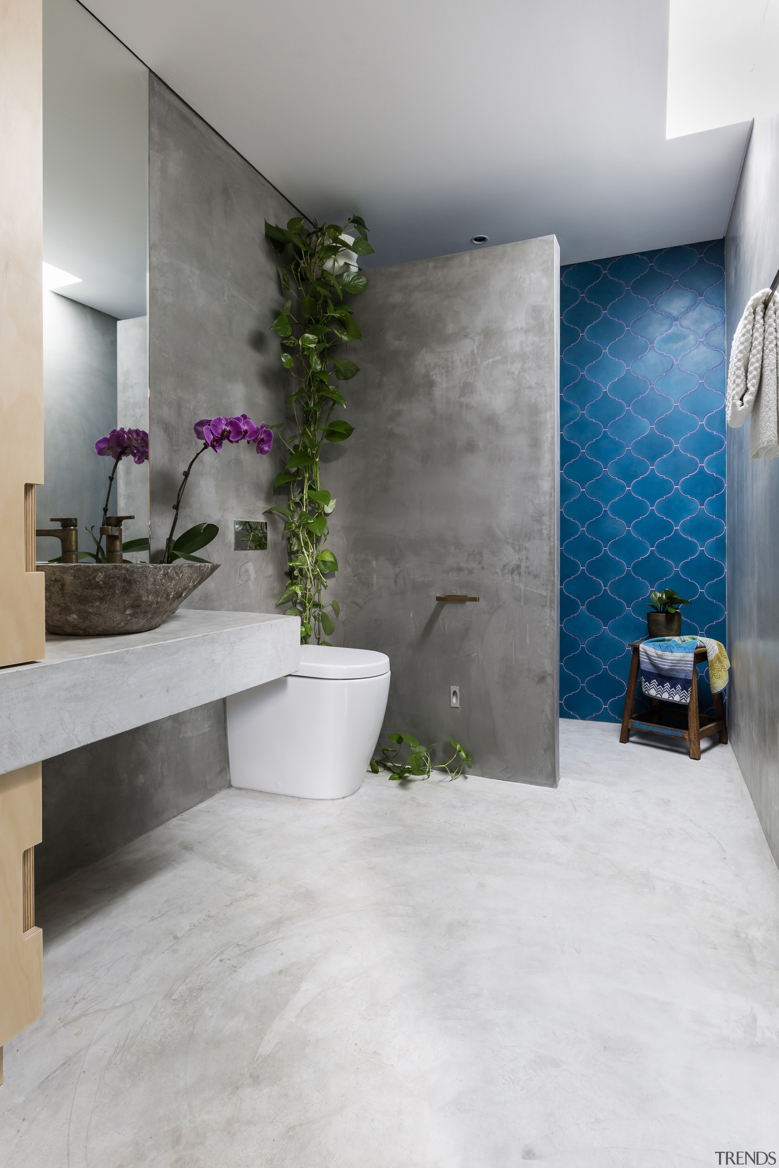 ​​​​​​​Want a durable, affordable floor that ties in architecture, bathroom, floor, flooring, home, house, interior design, room, tile, wall, gray, white, concrete vanity, Arc Seven