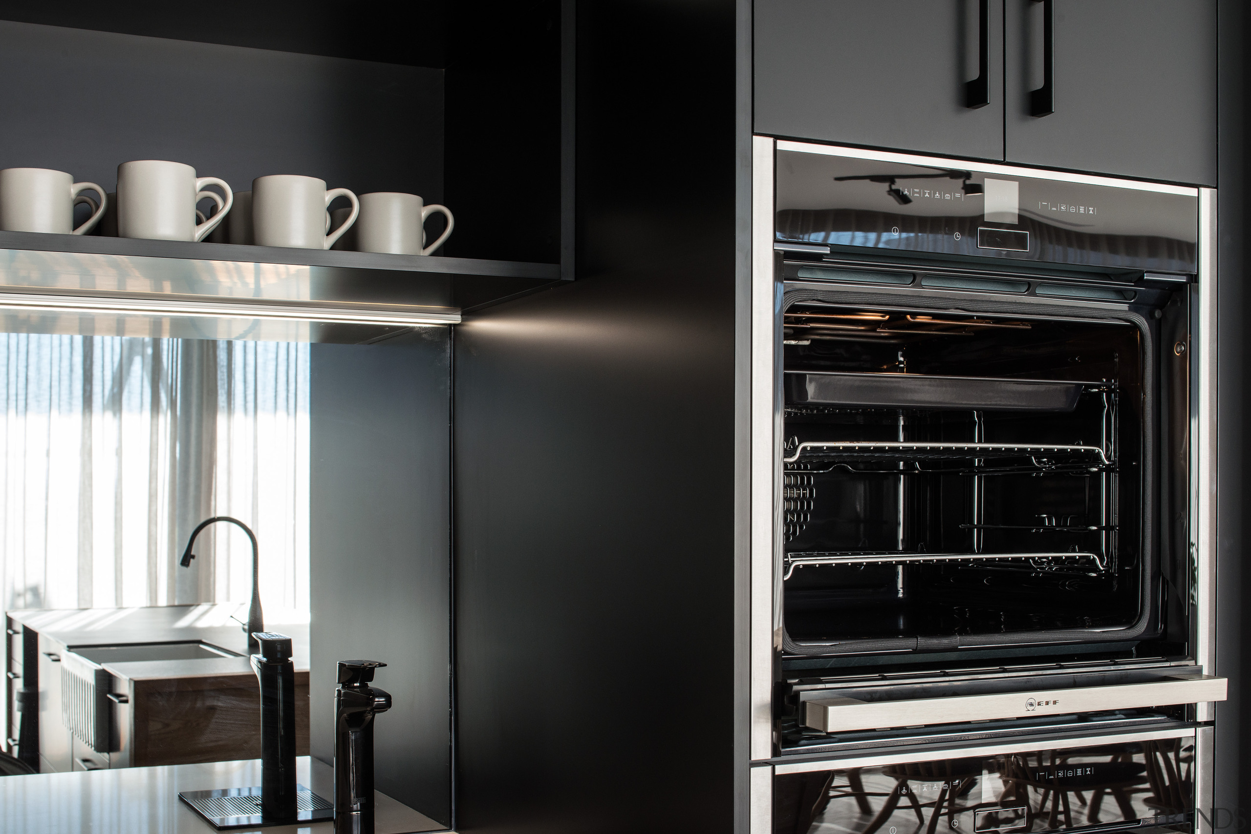 ​​​​​​​Black cabinetry by its nature can make a cabinetry, countertop, cupboard, door, interior design, kitchen, kitchen appliance, black, splashback, mirror, Impact kitchens