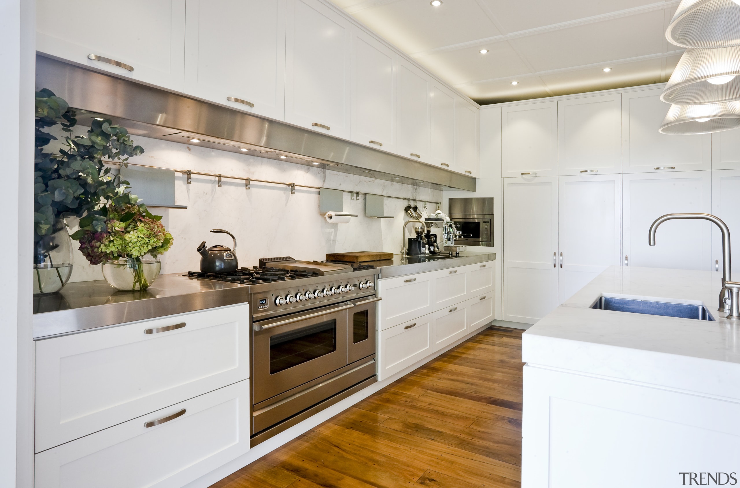 Contemporary stainless steel accents in this new kitchen cabinetry, countertop, cuisine classique, interior design, kitchen, real estate, room, white