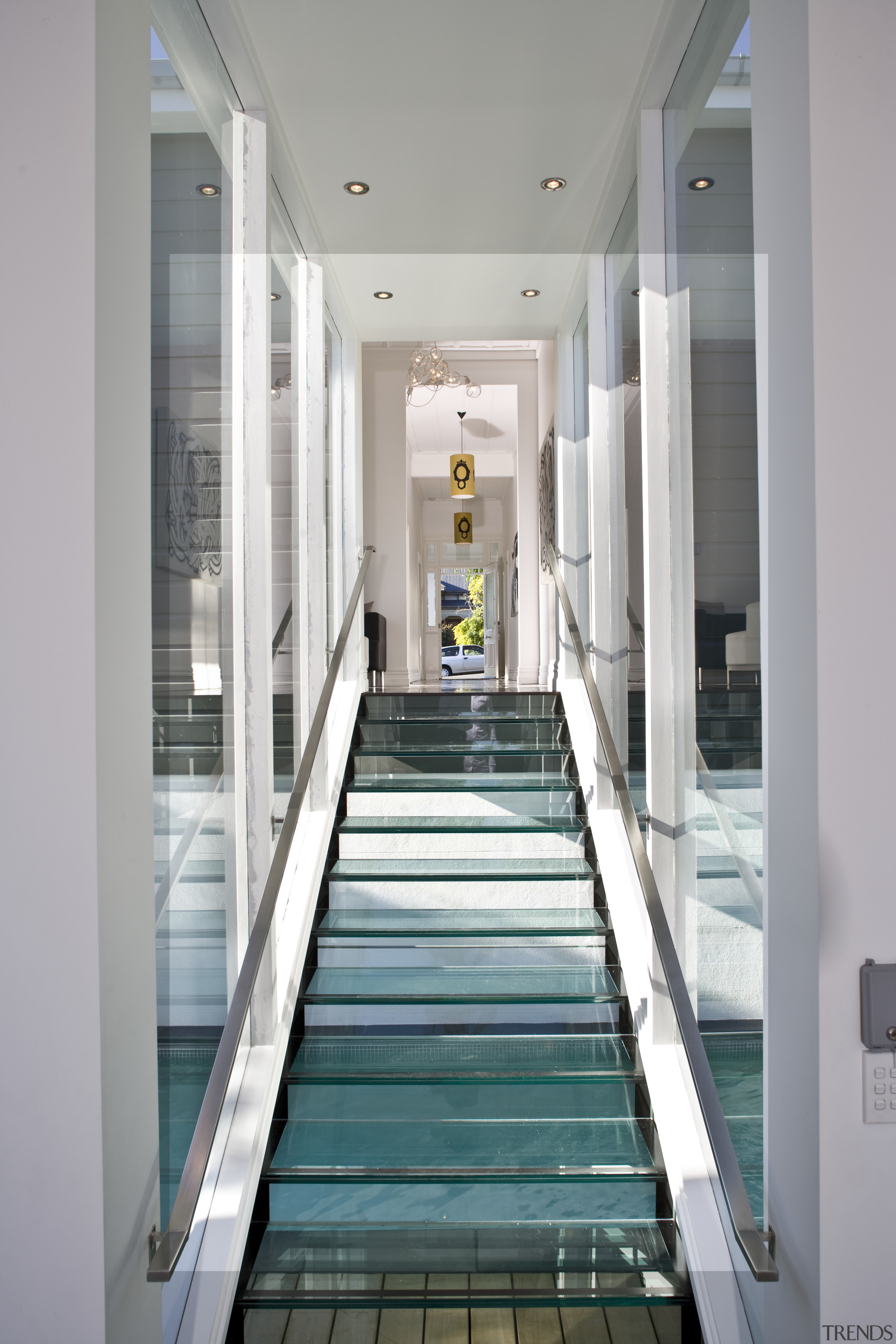 The glass stairwell is an extension of the architecture, daylighting, glass, interior design, stairs, window, gray