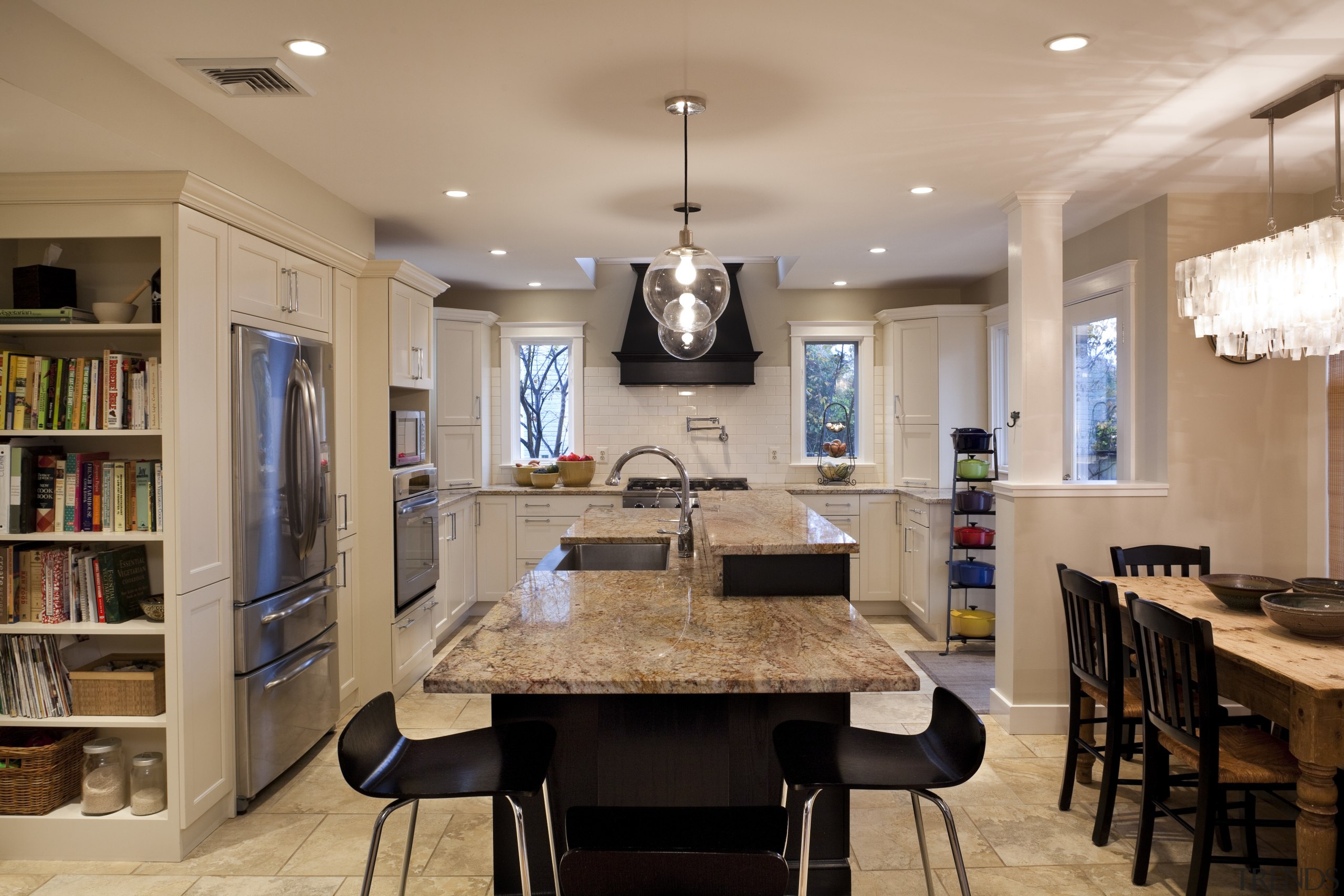 This kitchen was designed by Nadia Subaran of ceiling, countertop, dining room, interior design, kitchen, room, table, orange