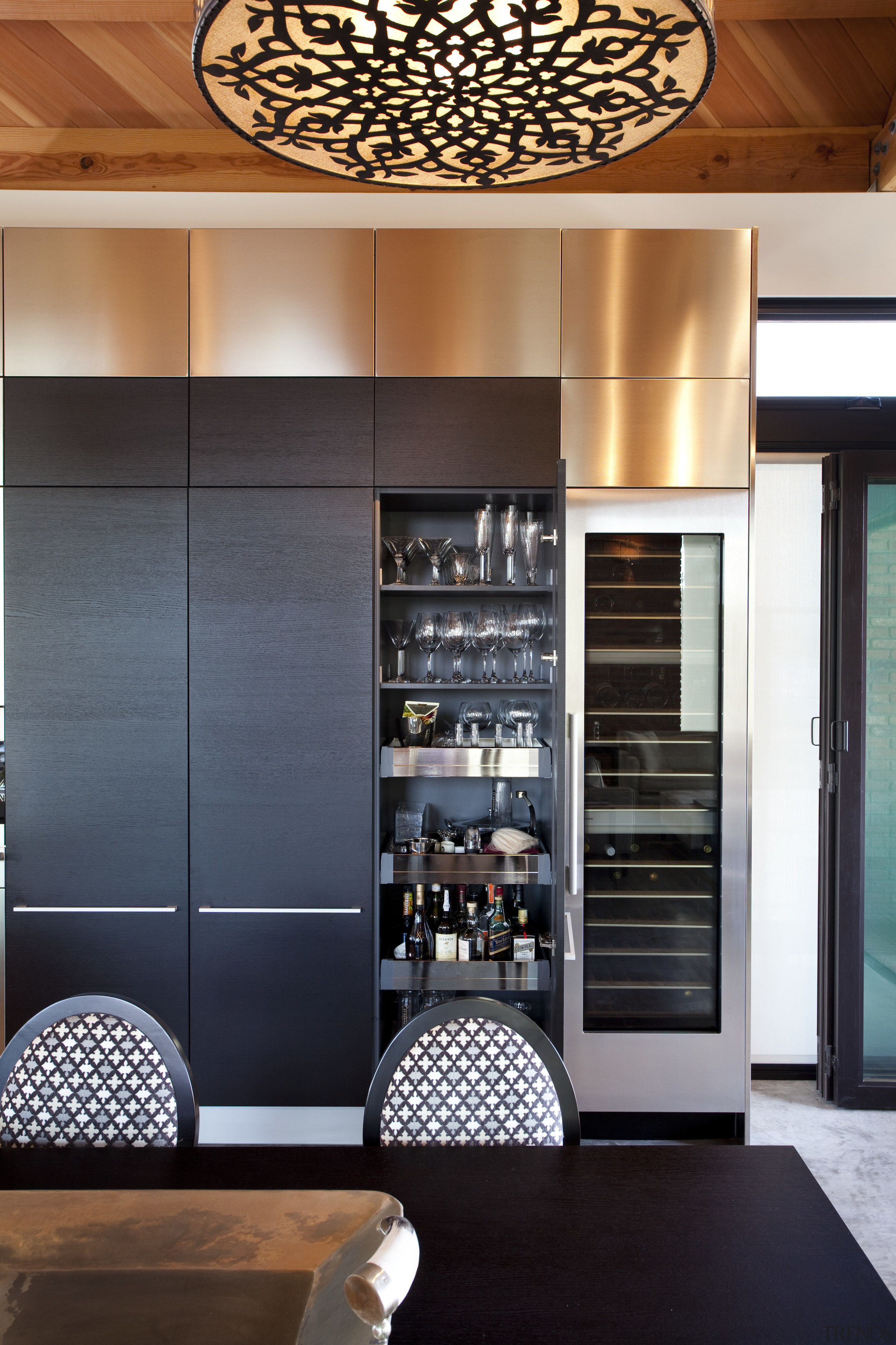 sliding doors reveal pantry behind, drinks refrigerator beside interior design, black