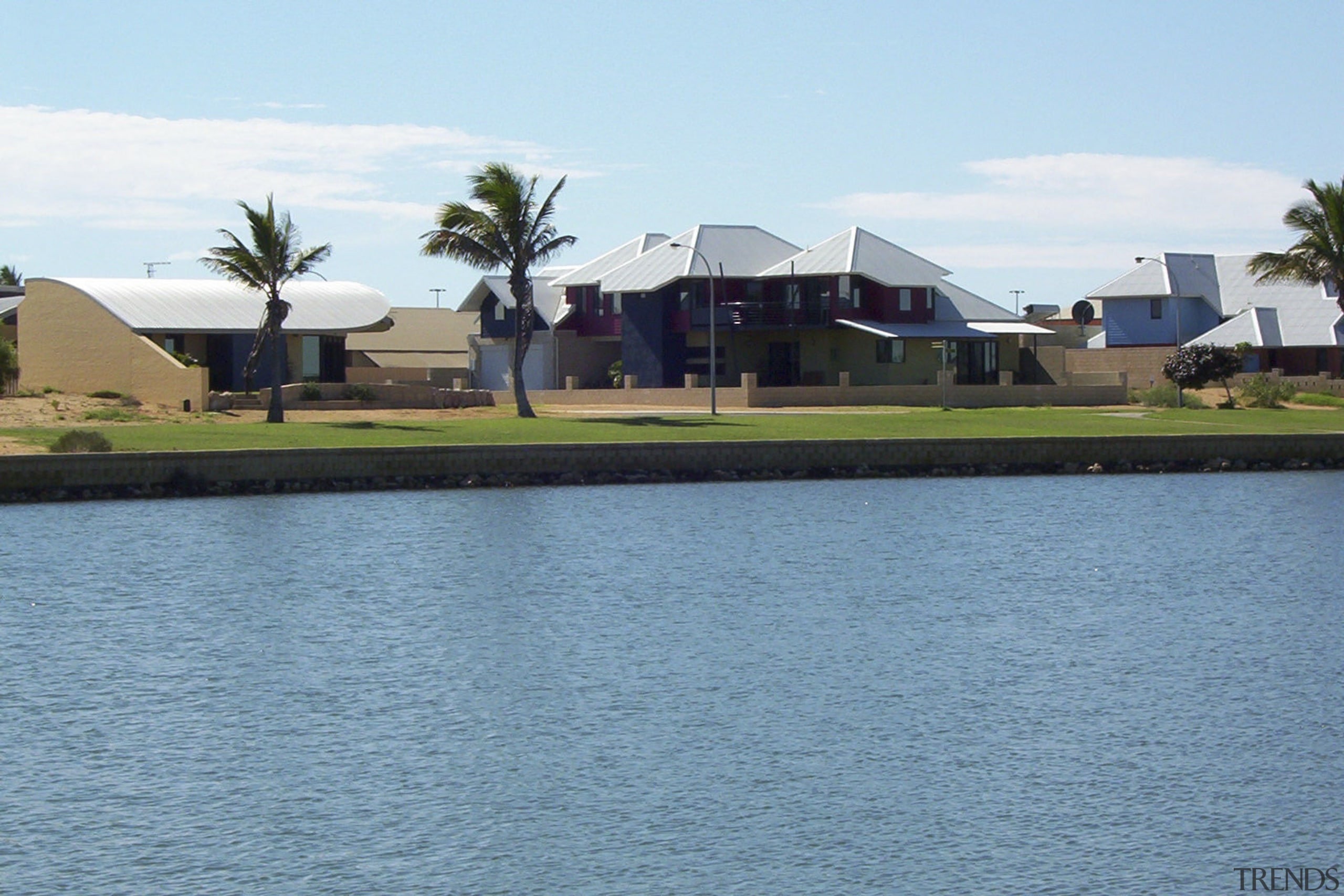 View of the Carnarvon doreshore in Gascoyne which coast, estate, home, house, leisure, palm tree, property, real estate, resort, sky, water, waterway, teal