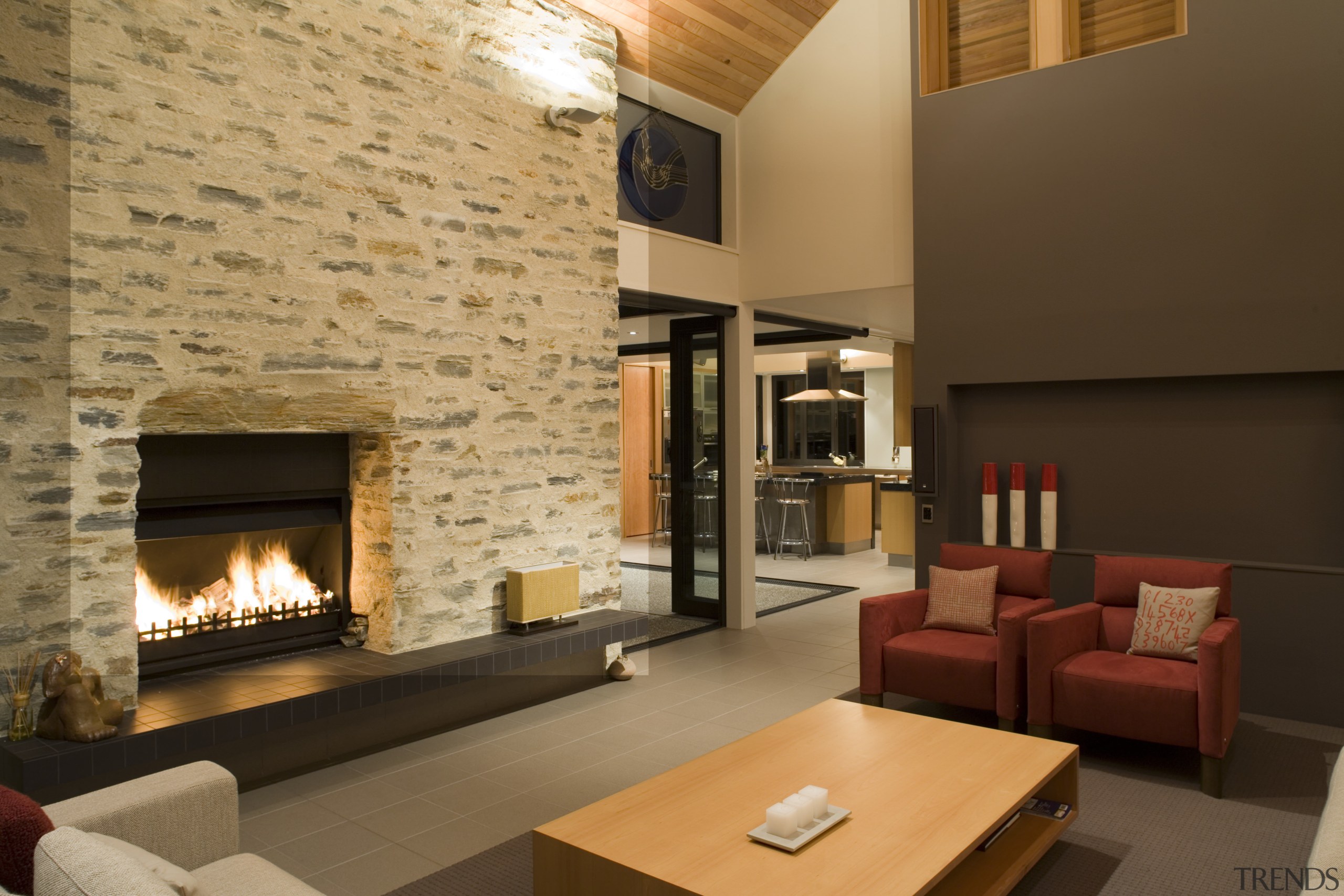 The main living pavilion is a spacious volume, fireplace, hearth, interior design, living room, real estate, brown, orange