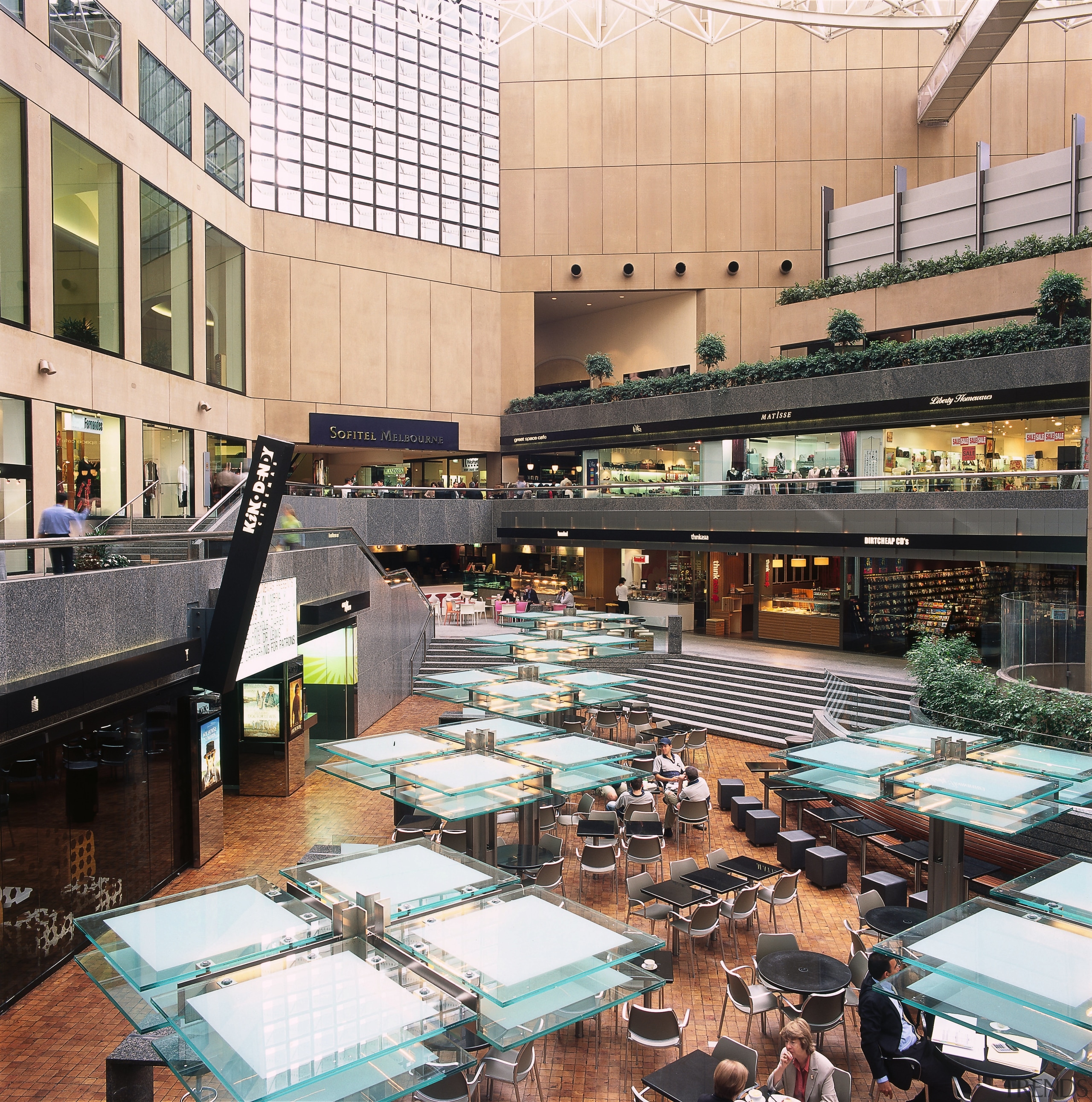 A view of the entire eatery area in building, city, metropolitan area, mixed use, shopping mall, white, black