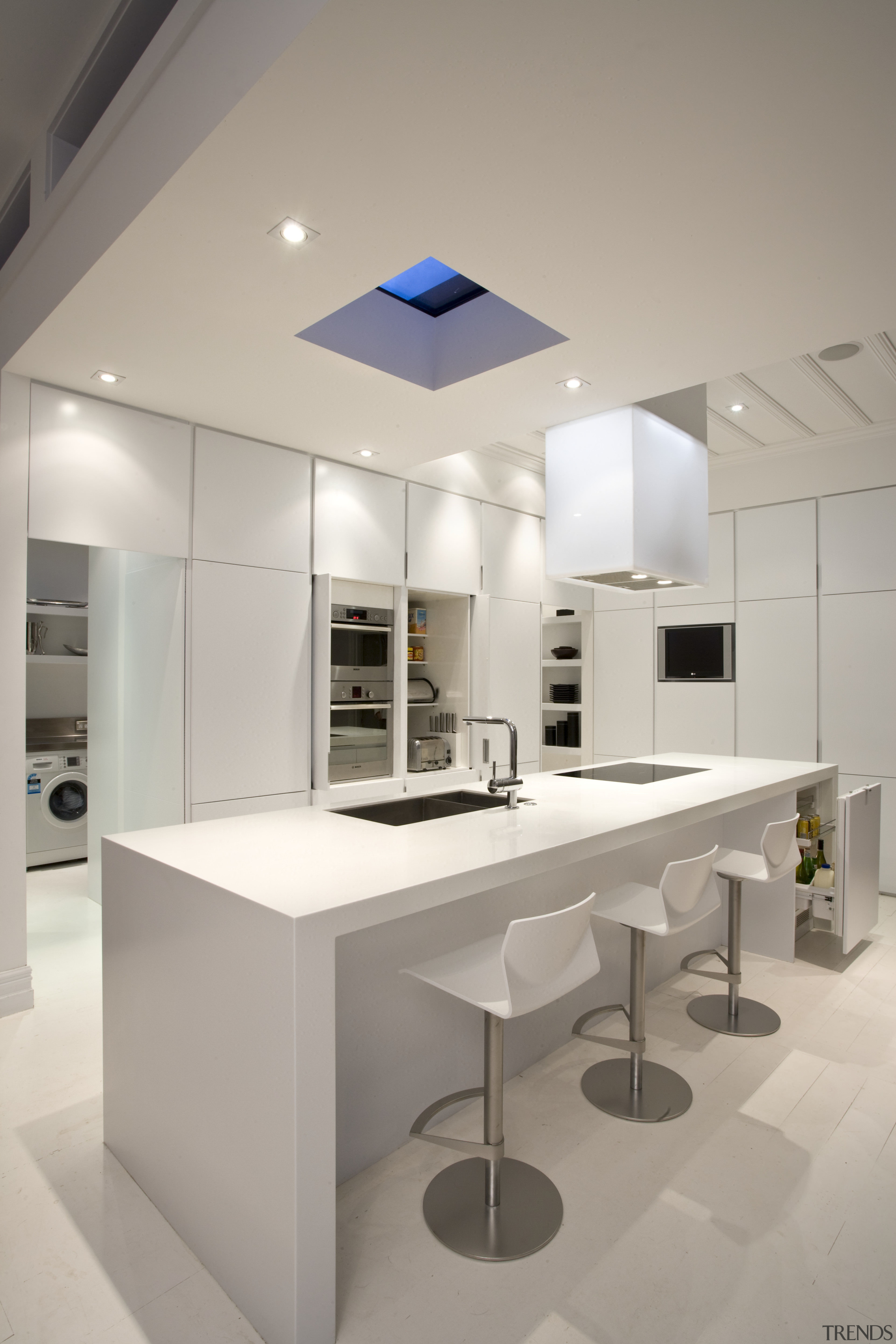 View of kitchen which features a kitchen island architecture, ceiling, countertop, daylighting, interior design, kitchen, product design, gray