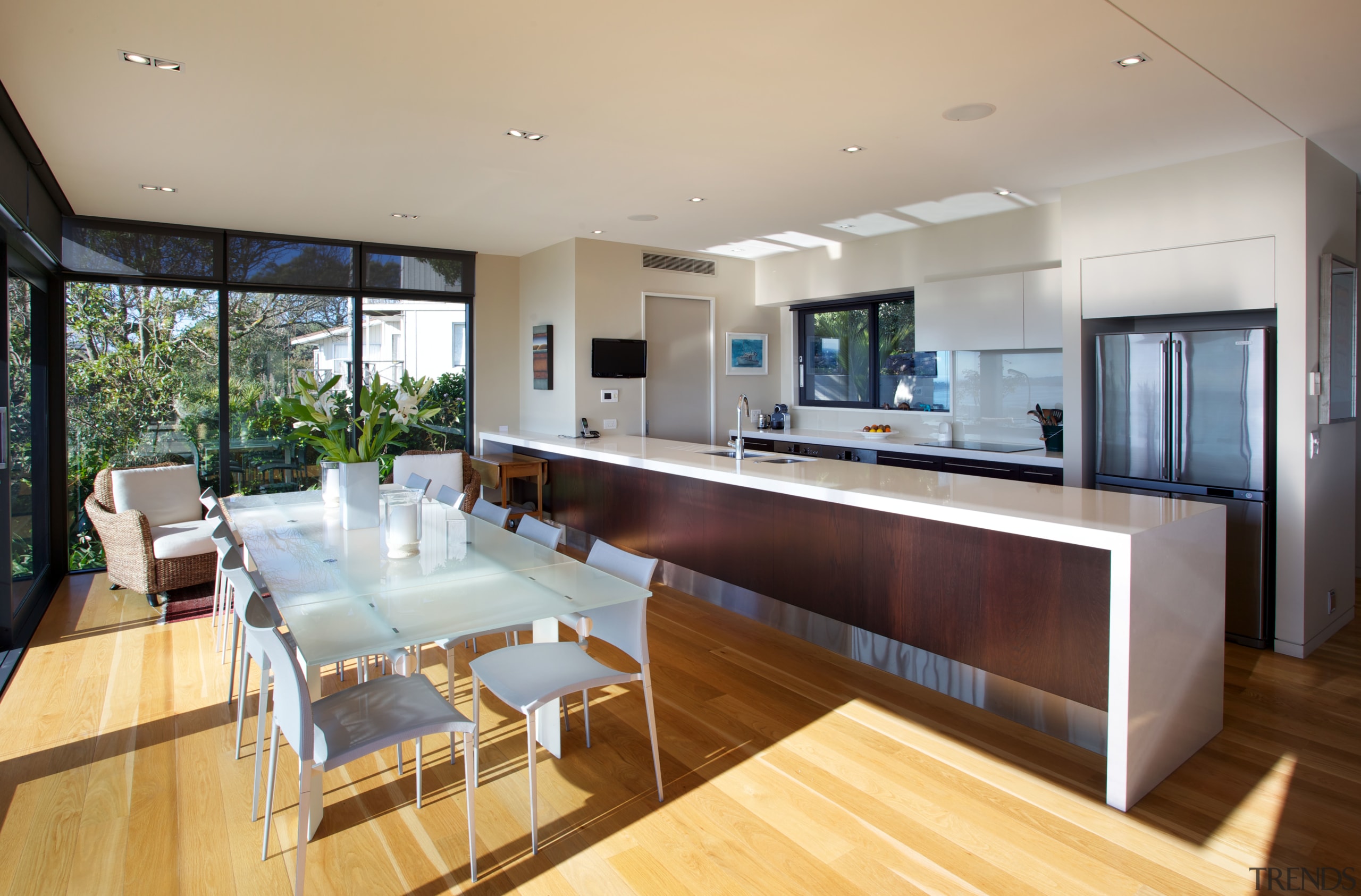 The galley kitchen faces views of the water. house, interior design, kitchen, living room, property, real estate, gray