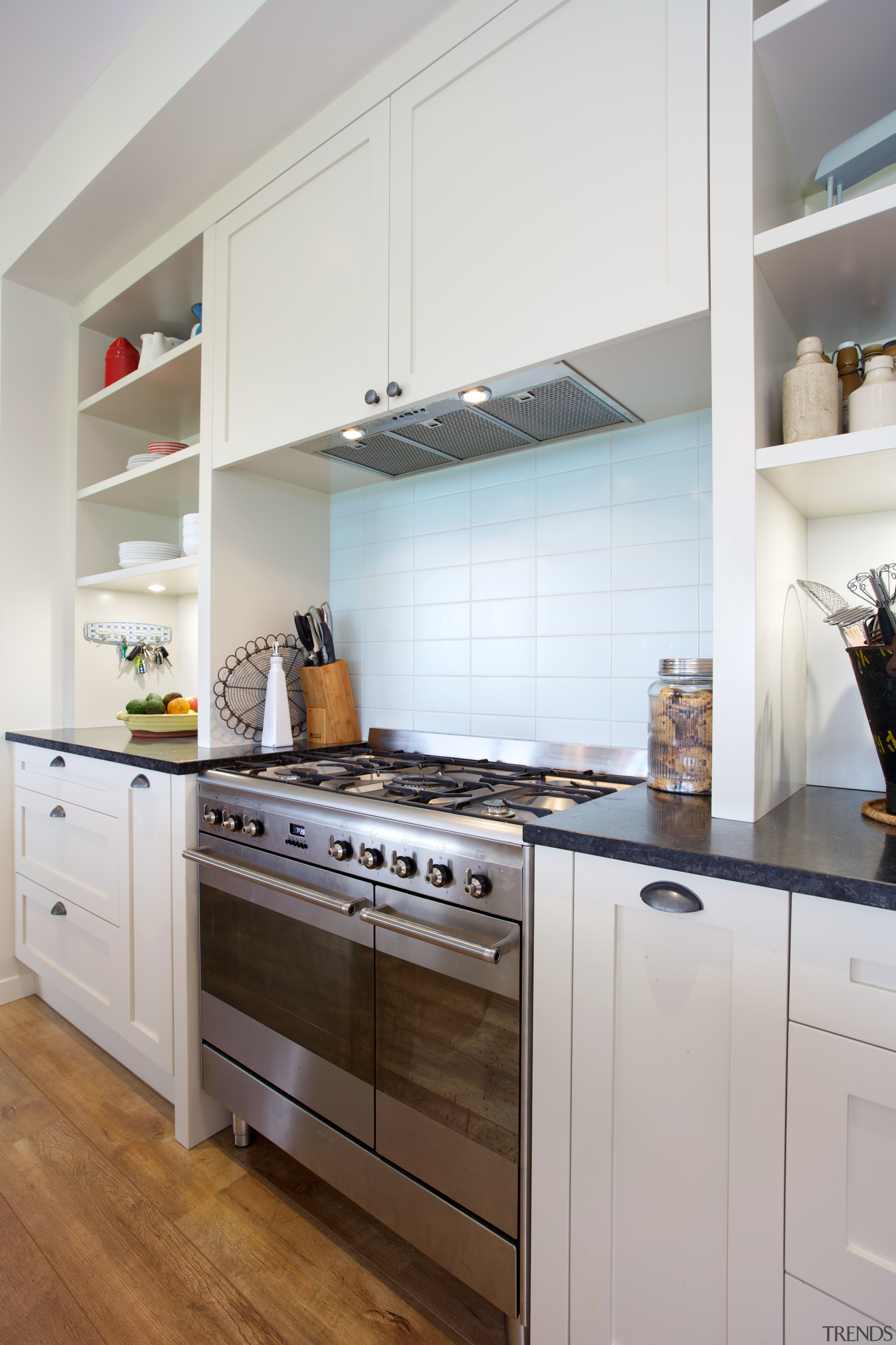 The traditional look of this kitchen is enhanced cabinetry, countertop, cuisine classique, home appliance, interior design, kitchen, kitchen appliance, kitchen stove, major appliance, refrigerator, room, gray, white