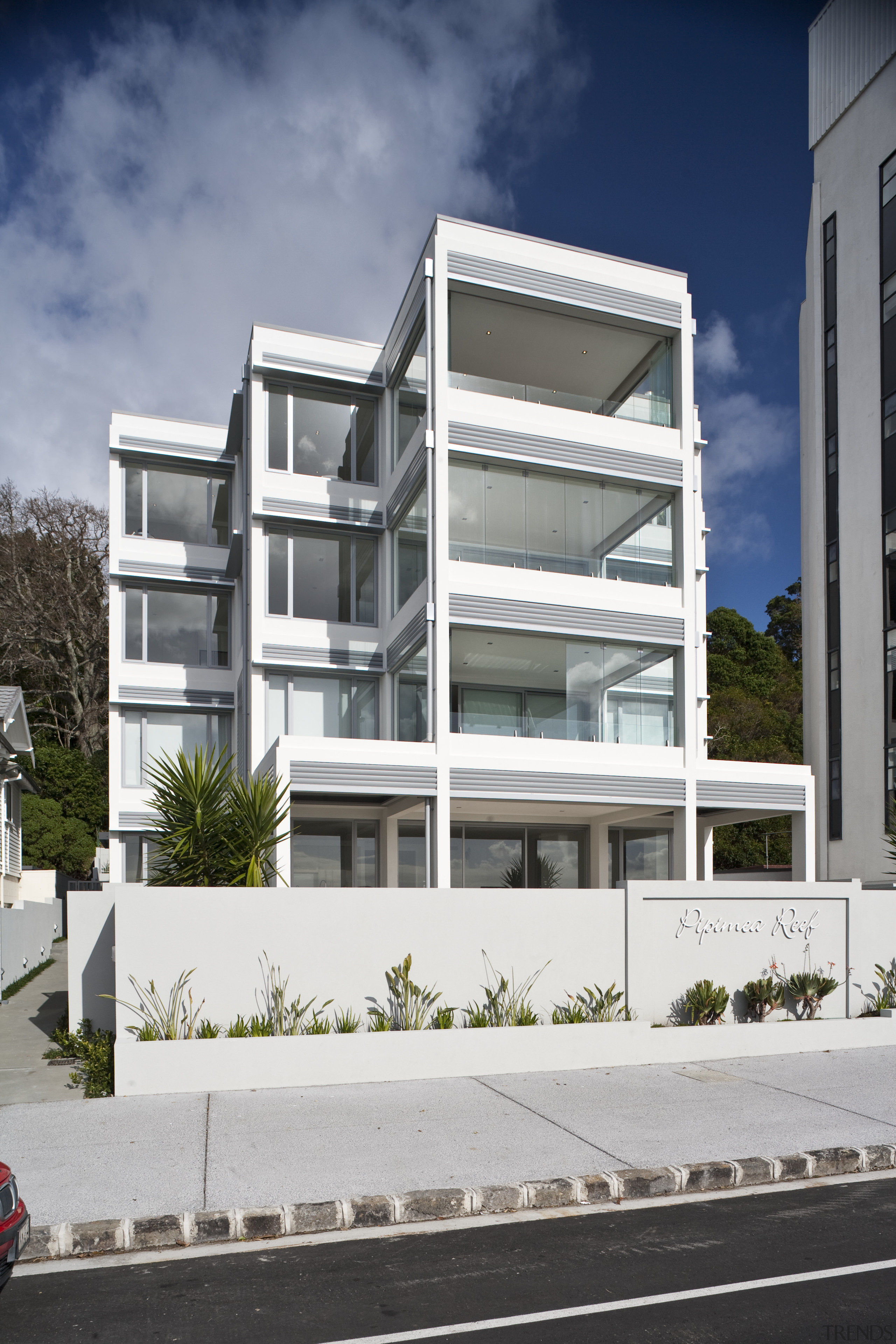 Exterior view of apartment building which features balconies apartment, architecture, building, commercial building, condominium, corporate headquarters, elevation, facade, home, house, mixed use, neighbourhood, property, real estate, residential area, window, gray, white